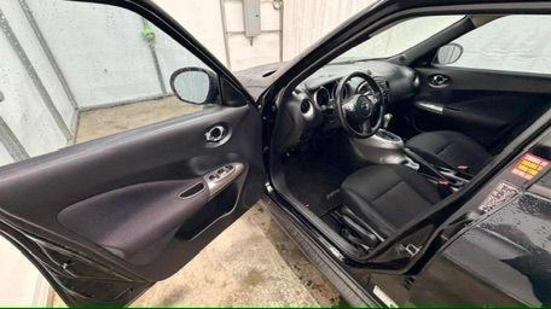 2014 Black Nissan Juke S FWD (JN8AF5MRXET) with an 1.6L L4 DOHC 16V TURBO engine, Continuously Variable Transmission transmission, located at 1806 Veterans Memorial Hwy SW, Austell, GA, 30168, (770) 944-9558, 33.817959, -84.606987 - Photo#10