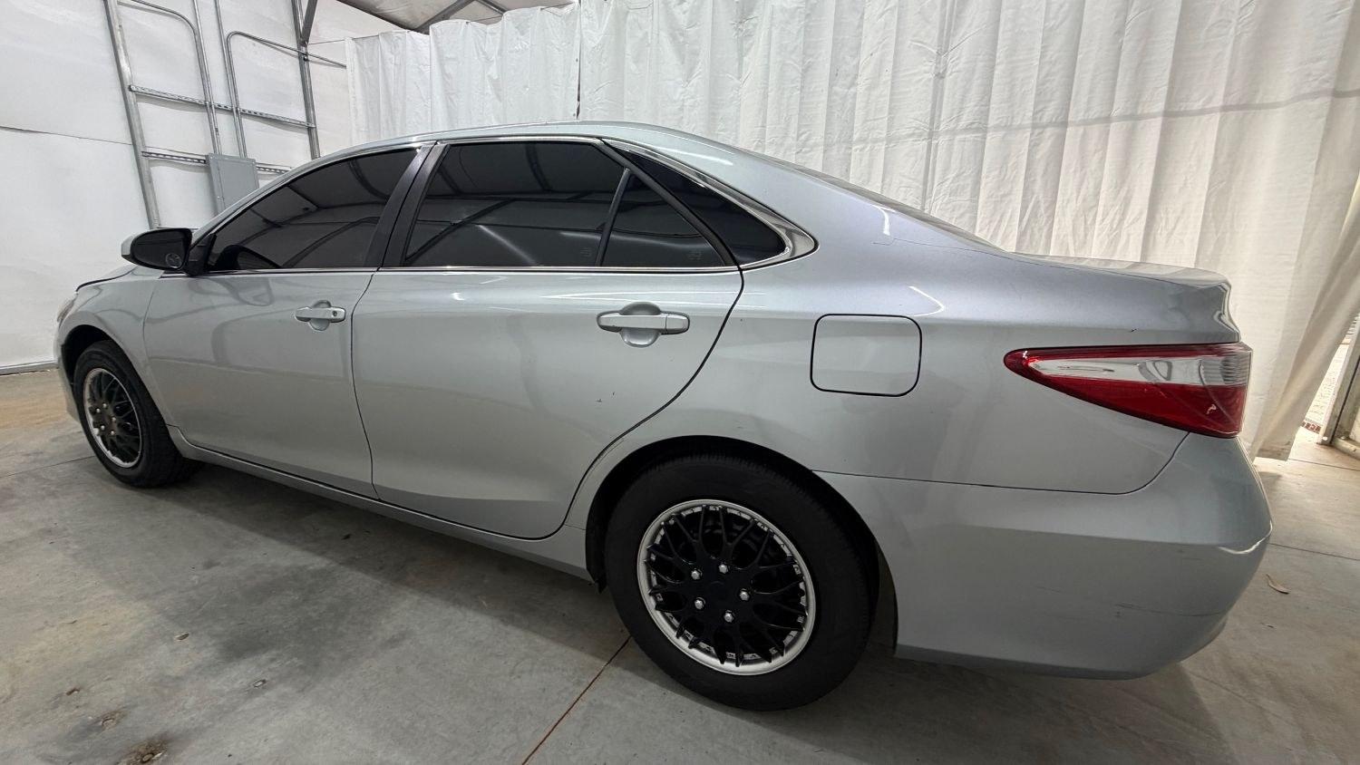 2017 Silver Toyota Camry LE (4T1BF1FK0HU) with an 2.5L L4 DOHC 16V engine, 6-Speed Automatic transmission, located at 1806 Veterans Memorial Hwy SW, Austell, GA, 30168, (770) 944-9558, 33.817959, -84.606987- Photo#2
