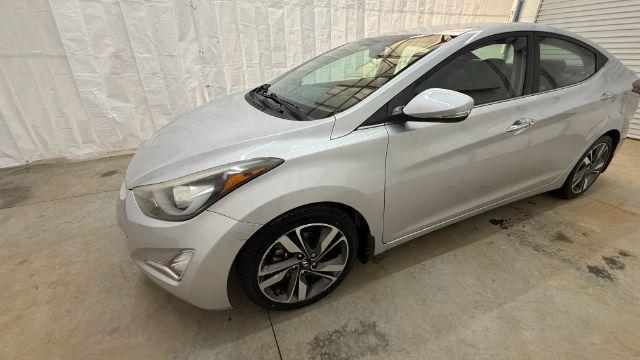 2016 Silver Hyundai Elantra Limited (KMHDH4AE7GU) with an 1.8L L4 DOHC 16V engine, 6-Speed Automatic transmission, located at 1806 Veterans Memorial Hwy SW, Austell, GA, 30168, (770) 944-9558, 33.817959, -84.606987 - Photo#1