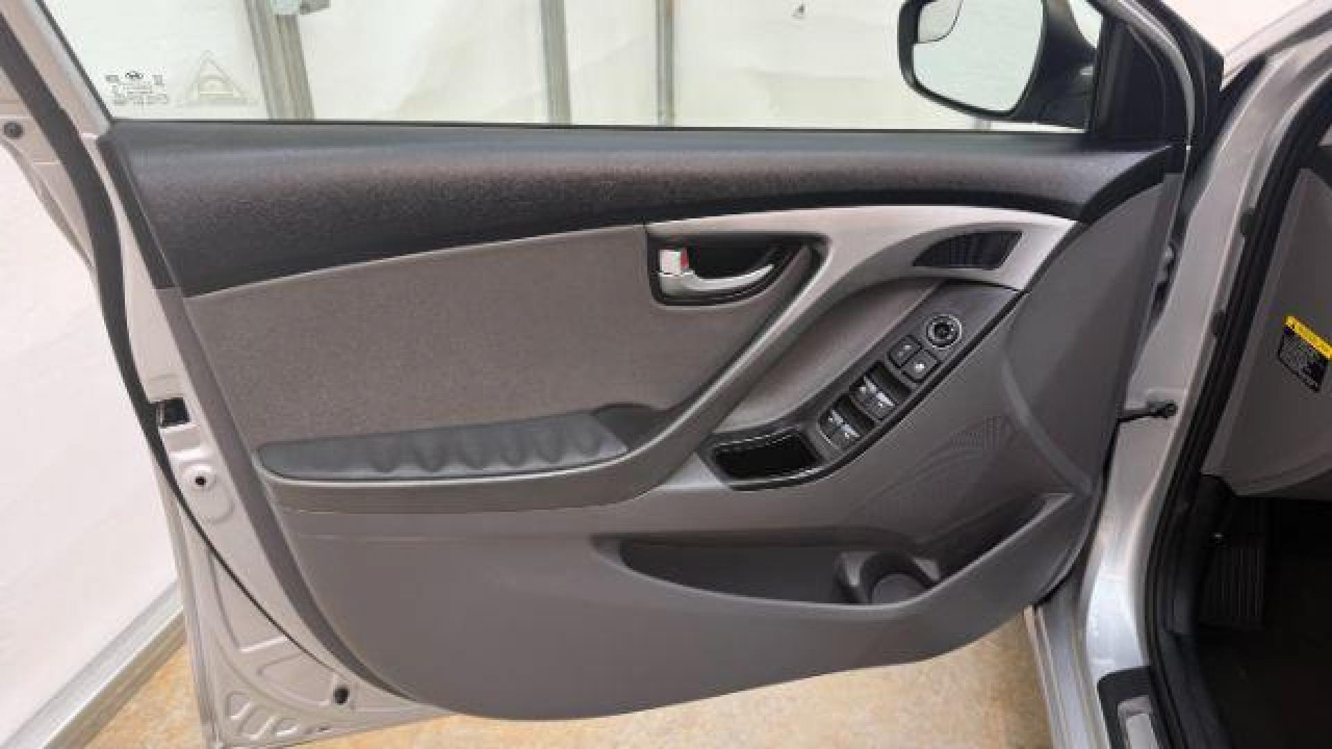 2016 Silver Hyundai Elantra Limited (KMHDH4AE7GU) with an 1.8L L4 DOHC 16V engine, 6-Speed Automatic transmission, located at 1806 Veterans Memorial Hwy SW, Austell, GA, 30168, (770) 944-9558, 33.817959, -84.606987 - Photo#10