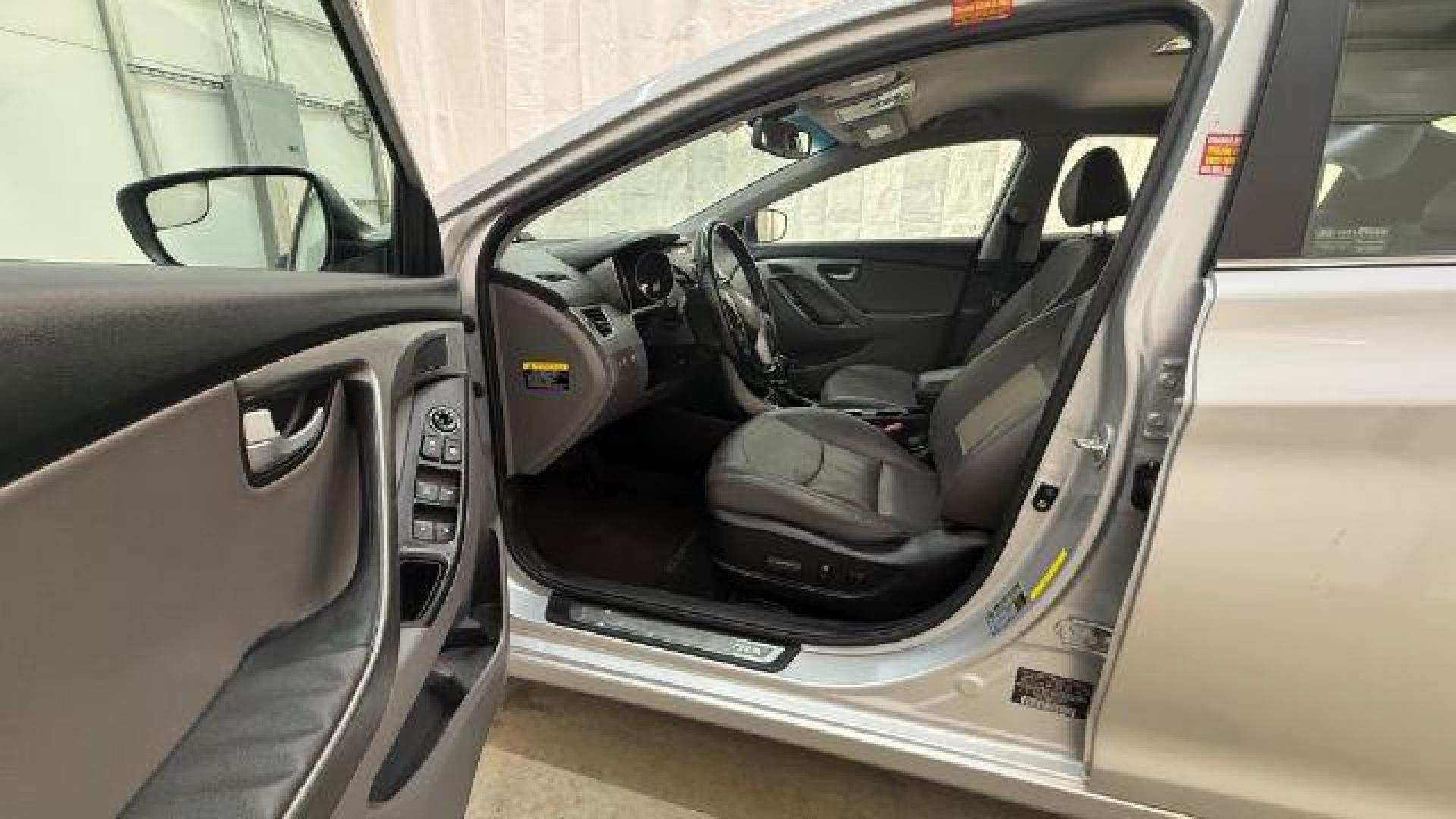 2016 Silver Hyundai Elantra Limited (KMHDH4AE7GU) with an 1.8L L4 DOHC 16V engine, 6-Speed Automatic transmission, located at 1806 Veterans Memorial Hwy SW, Austell, GA, 30168, (770) 944-9558, 33.817959, -84.606987 - Photo#12