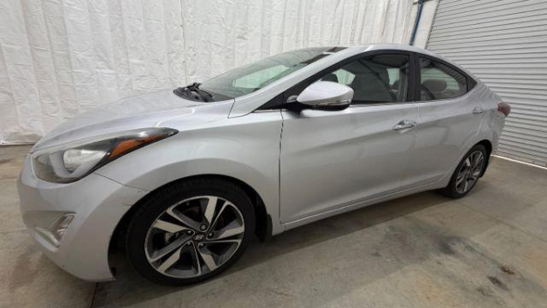 2016 Silver Hyundai Elantra Limited (KMHDH4AE7GU) with an 1.8L L4 DOHC 16V engine, 6-Speed Automatic transmission, located at 1806 Veterans Memorial Hwy SW, Austell, GA, 30168, (770) 944-9558, 33.817959, -84.606987 - Photo#1