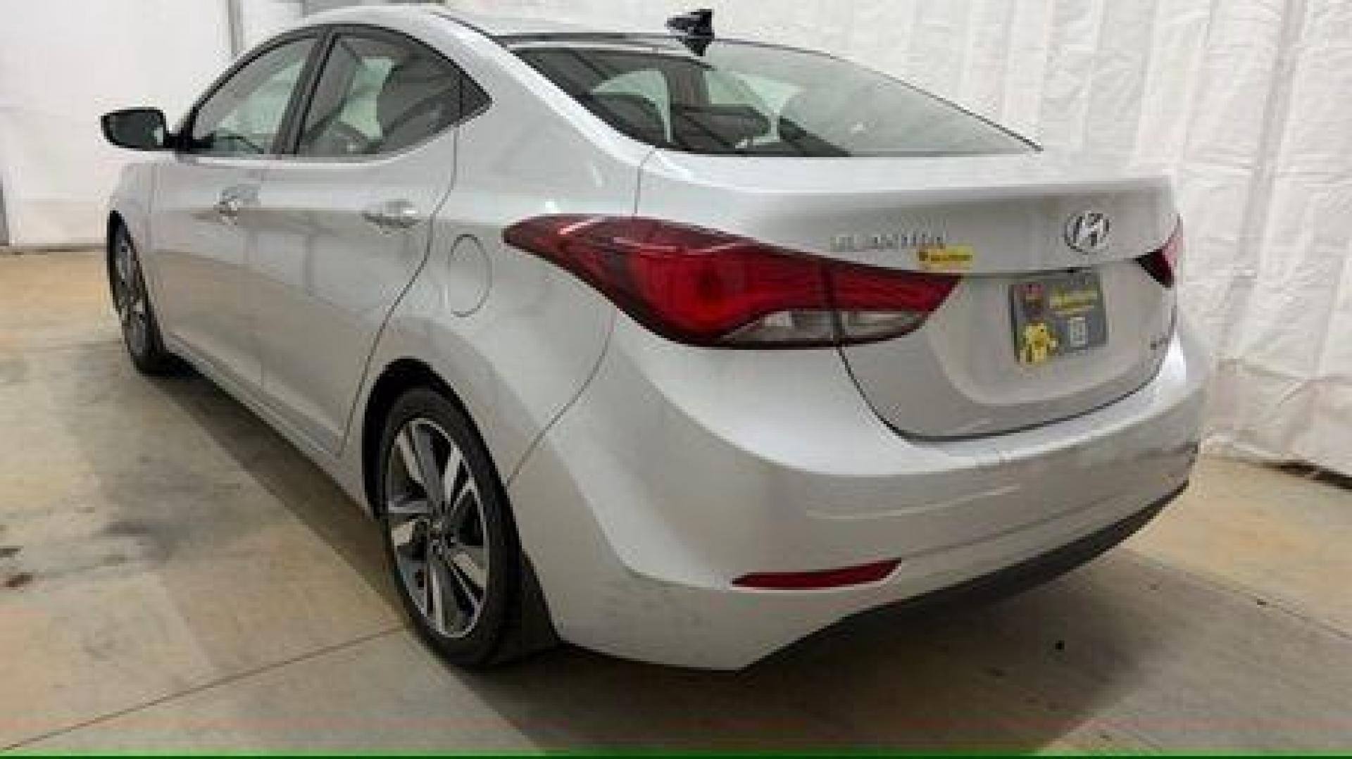 2016 Silver Hyundai Elantra Limited (KMHDH4AE7GU) with an 1.8L L4 DOHC 16V engine, 6-Speed Automatic transmission, located at 1806 Veterans Memorial Hwy SW, Austell, GA, 30168, (770) 944-9558, 33.817959, -84.606987 - Photo#3