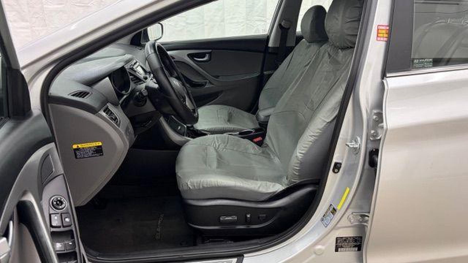 2016 Silver Hyundai Elantra Limited (KMHDH4AE7GU) with an 1.8L L4 DOHC 16V engine, 6-Speed Automatic transmission, located at 1806 Veterans Memorial Hwy SW, Austell, GA, 30168, (770) 944-9558, 33.817959, -84.606987 - Photo#11