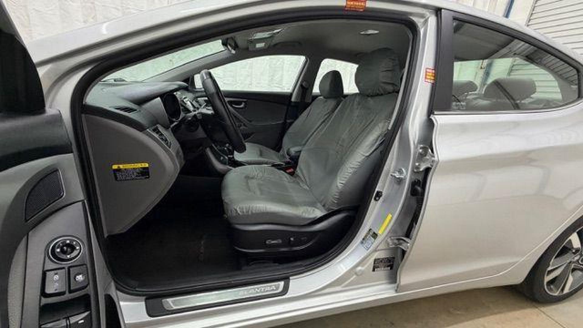 2016 Silver Hyundai Elantra Limited (KMHDH4AE7GU) with an 1.8L L4 DOHC 16V engine, 6-Speed Automatic transmission, located at 1806 Veterans Memorial Hwy SW, Austell, GA, 30168, (770) 944-9558, 33.817959, -84.606987 - Photo#12