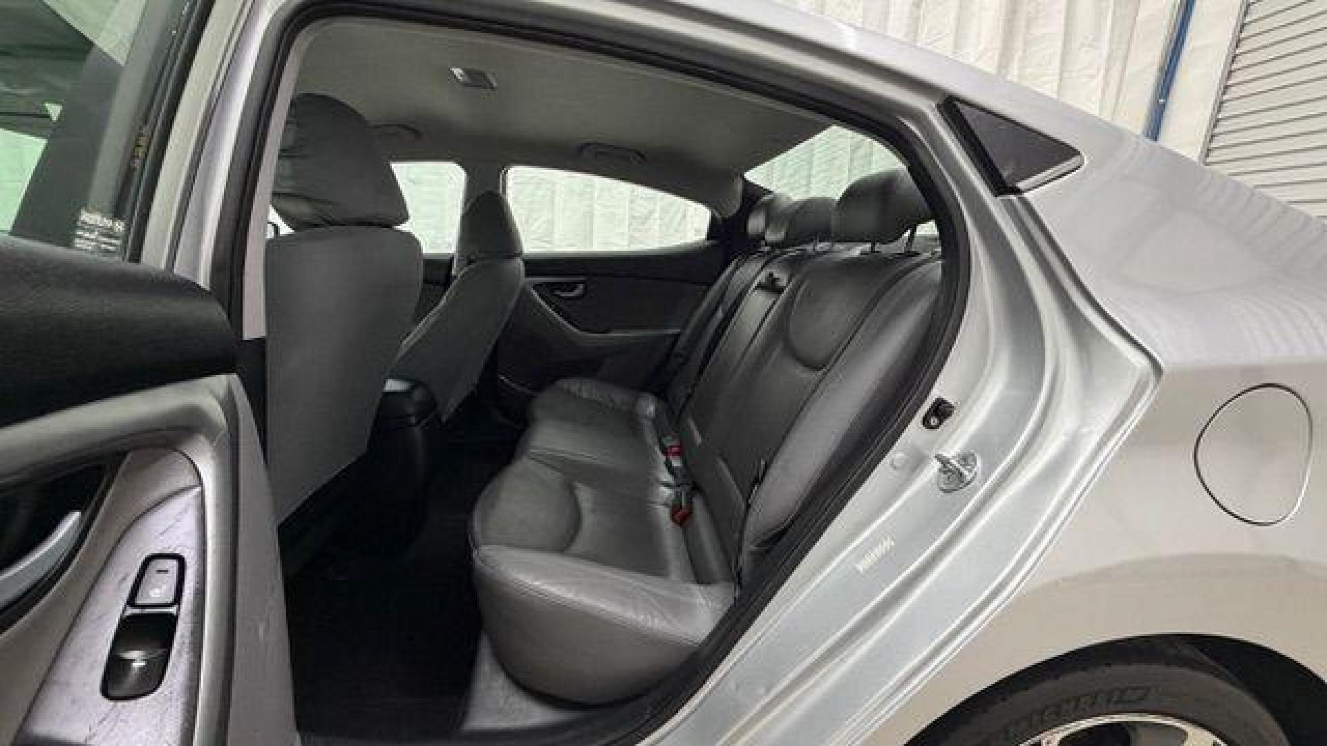 2016 Silver Hyundai Elantra Limited (KMHDH4AE7GU) with an 1.8L L4 DOHC 16V engine, 6-Speed Automatic transmission, located at 1806 Veterans Memorial Hwy SW, Austell, GA, 30168, (770) 944-9558, 33.817959, -84.606987 - Photo#14