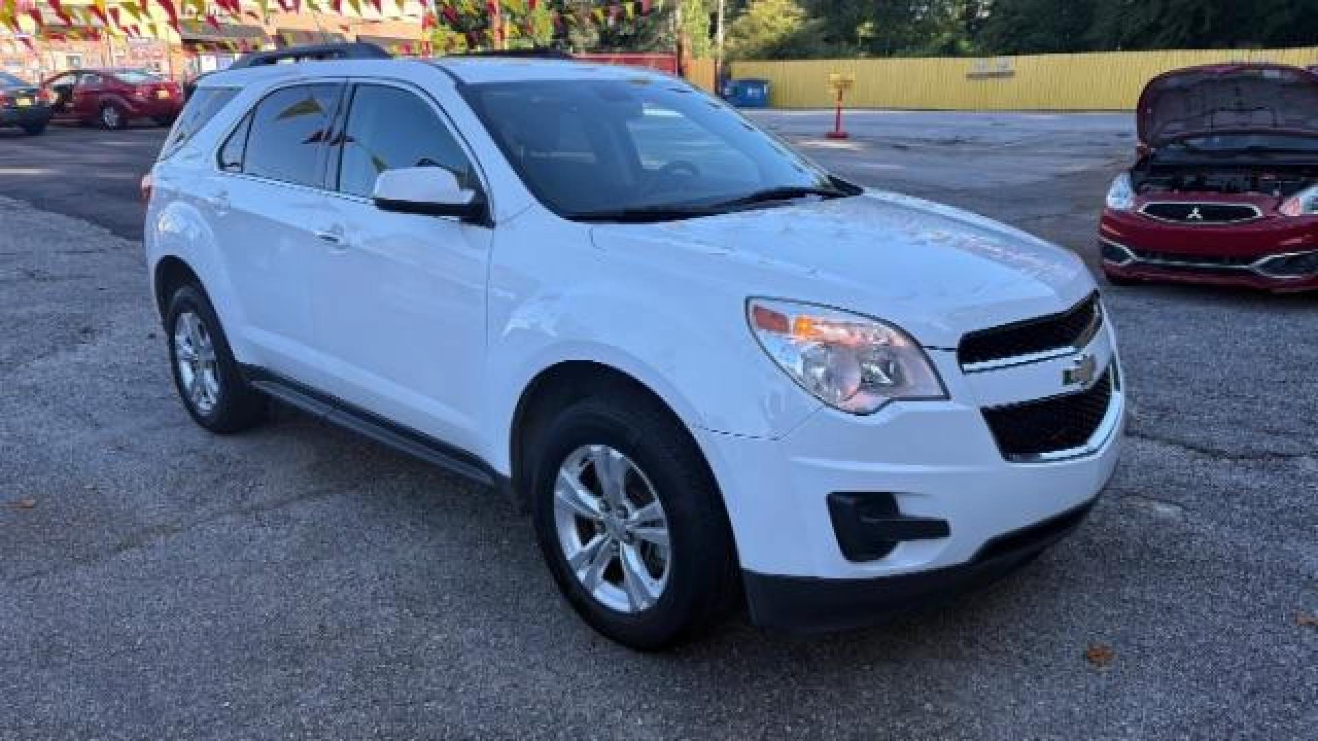 2011 White Chevrolet Equinox 1LT 2WD (2GNALDEC6B1) with an 2.4L L4 DOHC 16V engine, 6-Speed Automatic transmission, located at 1806 Veterans Memorial Hwy SW, Austell, GA, 30168, (770) 944-9558, 33.817959, -84.606987 - Photo#2