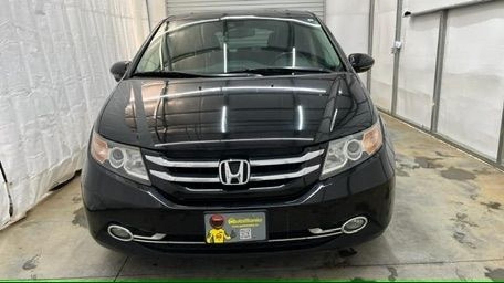 2015 Black Honda Odyssey Touring (5FNRL5H91FB) with an 3.5L V6 SOHC 24V engine, 6-Speed Automatic transmission, located at 1806 Veterans Memorial Hwy SW, Austell, GA, 30168, (770) 944-9558, 33.817959, -84.606987- Photo#1