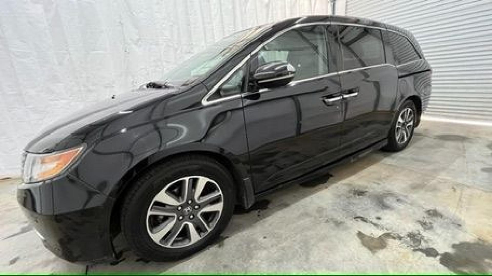 2015 Black Honda Odyssey Touring (5FNRL5H91FB) with an 3.5L V6 SOHC 24V engine, 6-Speed Automatic transmission, located at 1806 Veterans Memorial Hwy SW, Austell, GA, 30168, (770) 944-9558, 33.817959, -84.606987- Photo#2
