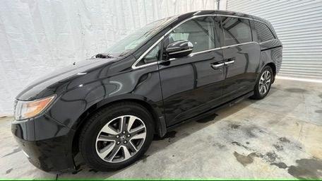 2015 Black Honda Odyssey Touring (5FNRL5H91FB) with an 3.5L V6 SOHC 24V engine, 6-Speed Automatic transmission, located at 1806 Veterans Memorial Hwy SW, Austell, GA, 30168, (770) 944-9558, 33.817959, -84.606987 - Photo#2
