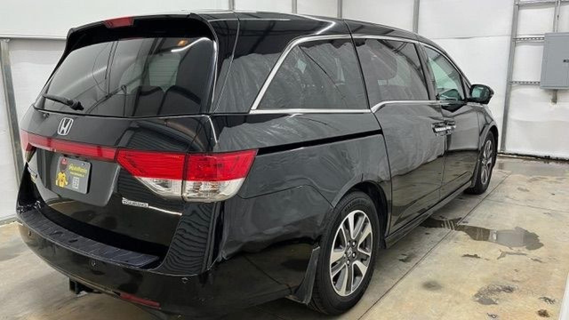 2015 Black Honda Odyssey Touring (5FNRL5H91FB) with an 3.5L V6 SOHC 24V engine, 6-Speed Automatic transmission, located at 1806 Veterans Memorial Hwy SW, Austell, GA, 30168, (770) 944-9558, 33.817959, -84.606987- Photo#4