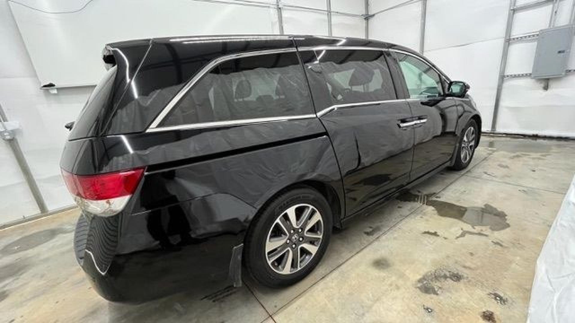 2015 Black Honda Odyssey Touring (5FNRL5H91FB) with an 3.5L V6 SOHC 24V engine, 6-Speed Automatic transmission, located at 1806 Veterans Memorial Hwy SW, Austell, GA, 30168, (770) 944-9558, 33.817959, -84.606987- Photo#5