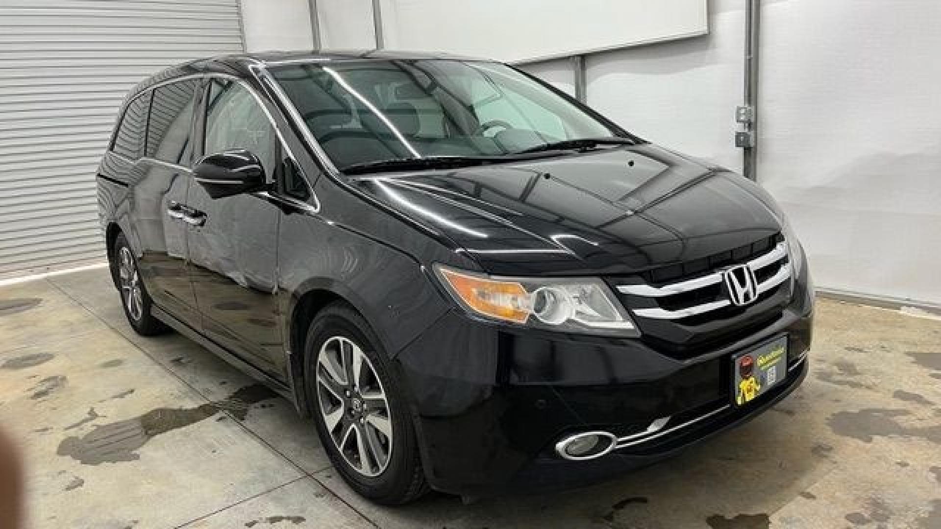 2015 Black Honda Odyssey Touring (5FNRL5H91FB) with an 3.5L V6 SOHC 24V engine, 6-Speed Automatic transmission, located at 1806 Veterans Memorial Hwy SW, Austell, GA, 30168, (770) 944-9558, 33.817959, -84.606987- Photo#6