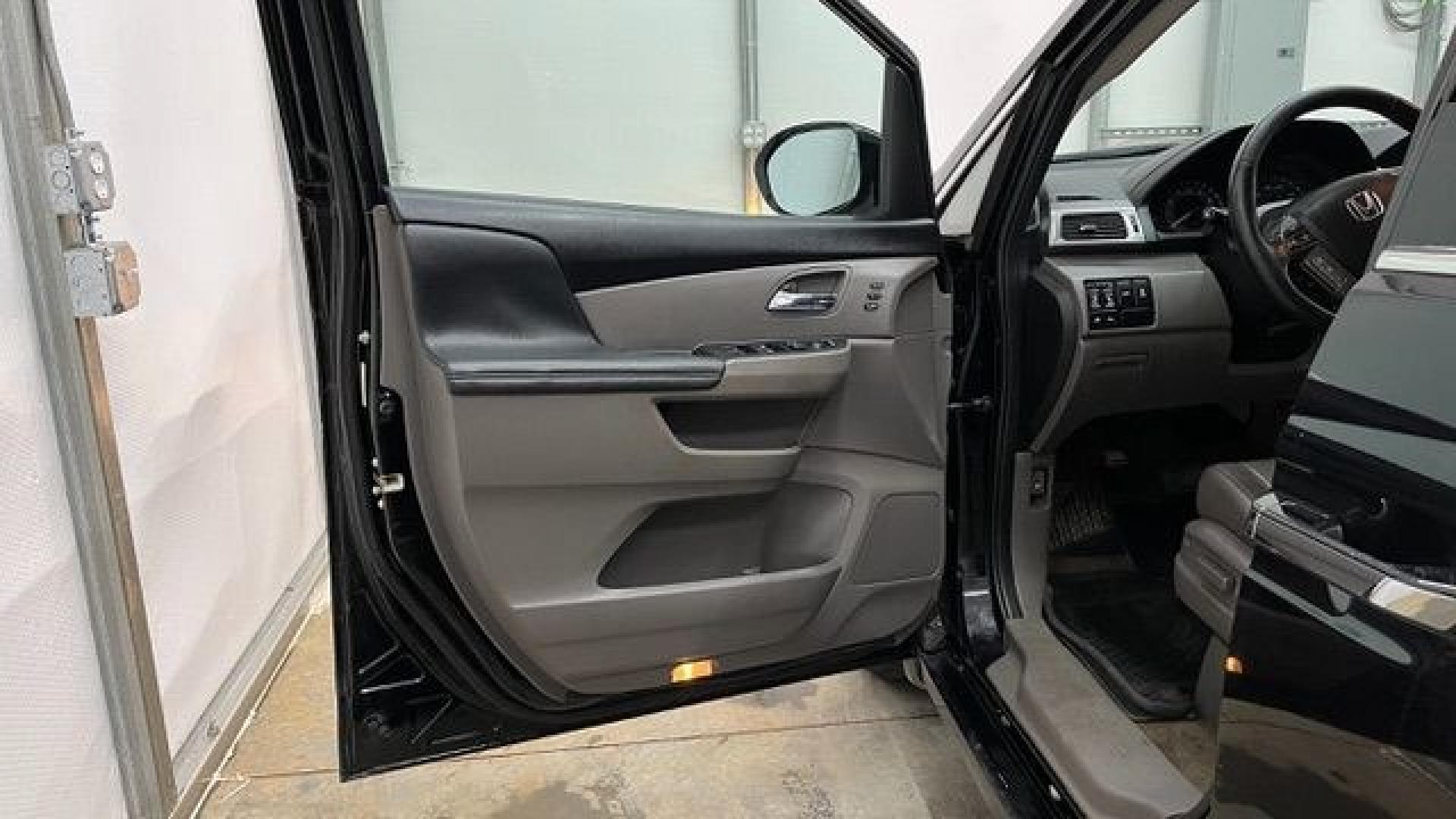 2015 Black Honda Odyssey Touring (5FNRL5H91FB) with an 3.5L V6 SOHC 24V engine, 6-Speed Automatic transmission, located at 1806 Veterans Memorial Hwy SW, Austell, GA, 30168, (770) 944-9558, 33.817959, -84.606987- Photo#7