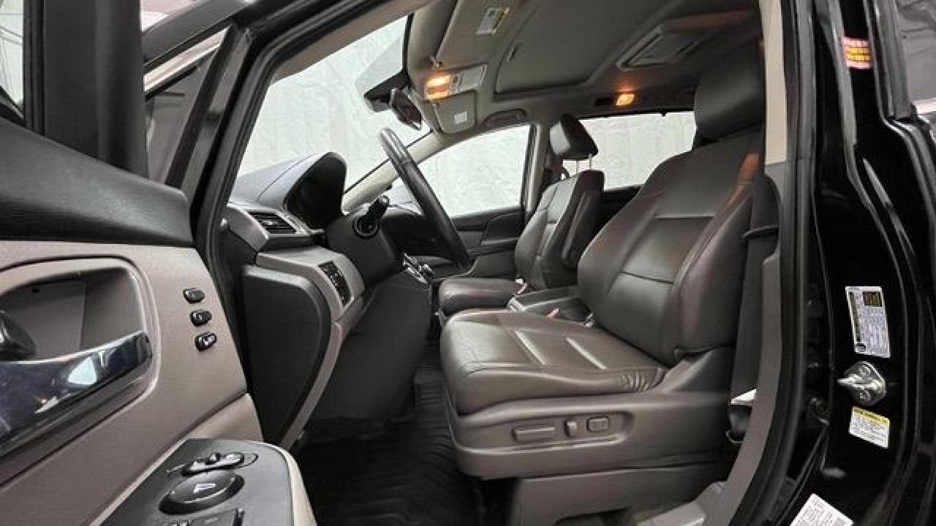 2015 Black Honda Odyssey Touring (5FNRL5H91FB) with an 3.5L V6 SOHC 24V engine, 6-Speed Automatic transmission, located at 1806 Veterans Memorial Hwy SW, Austell, GA, 30168, (770) 944-9558, 33.817959, -84.606987- Photo#8