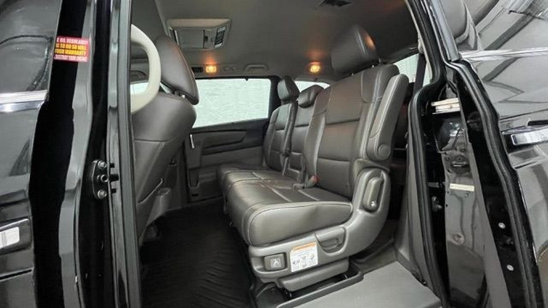 2015 Black Honda Odyssey Touring (5FNRL5H91FB) with an 3.5L V6 SOHC 24V engine, 6-Speed Automatic transmission, located at 1806 Veterans Memorial Hwy SW, Austell, GA, 30168, (770) 944-9558, 33.817959, -84.606987- Photo#9