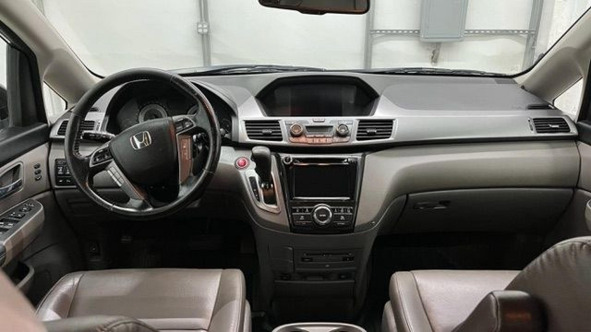 2015 Black Honda Odyssey Touring (5FNRL5H91FB) with an 3.5L V6 SOHC 24V engine, 6-Speed Automatic transmission, located at 1806 Veterans Memorial Hwy SW, Austell, GA, 30168, (770) 944-9558, 33.817959, -84.606987- Photo#11