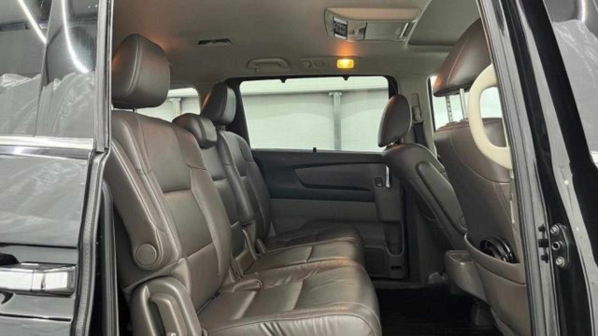 2015 Black Honda Odyssey Touring (5FNRL5H91FB) with an 3.5L V6 SOHC 24V engine, 6-Speed Automatic transmission, located at 1806 Veterans Memorial Hwy SW, Austell, GA, 30168, (770) 944-9558, 33.817959, -84.606987- Photo#12