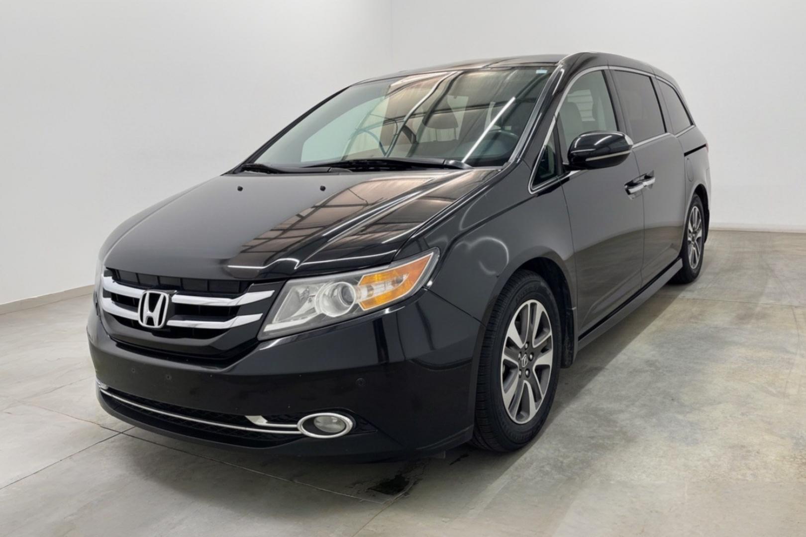 2015 Black Honda Odyssey Touring (5FNRL5H91FB) with an 3.5L V6 SOHC 24V engine, 6-Speed Automatic transmission, located at 1806 Veterans Memorial Hwy SW, Austell, GA, 30168, (770) 944-9558, 33.817959, -84.606987- Photo#0