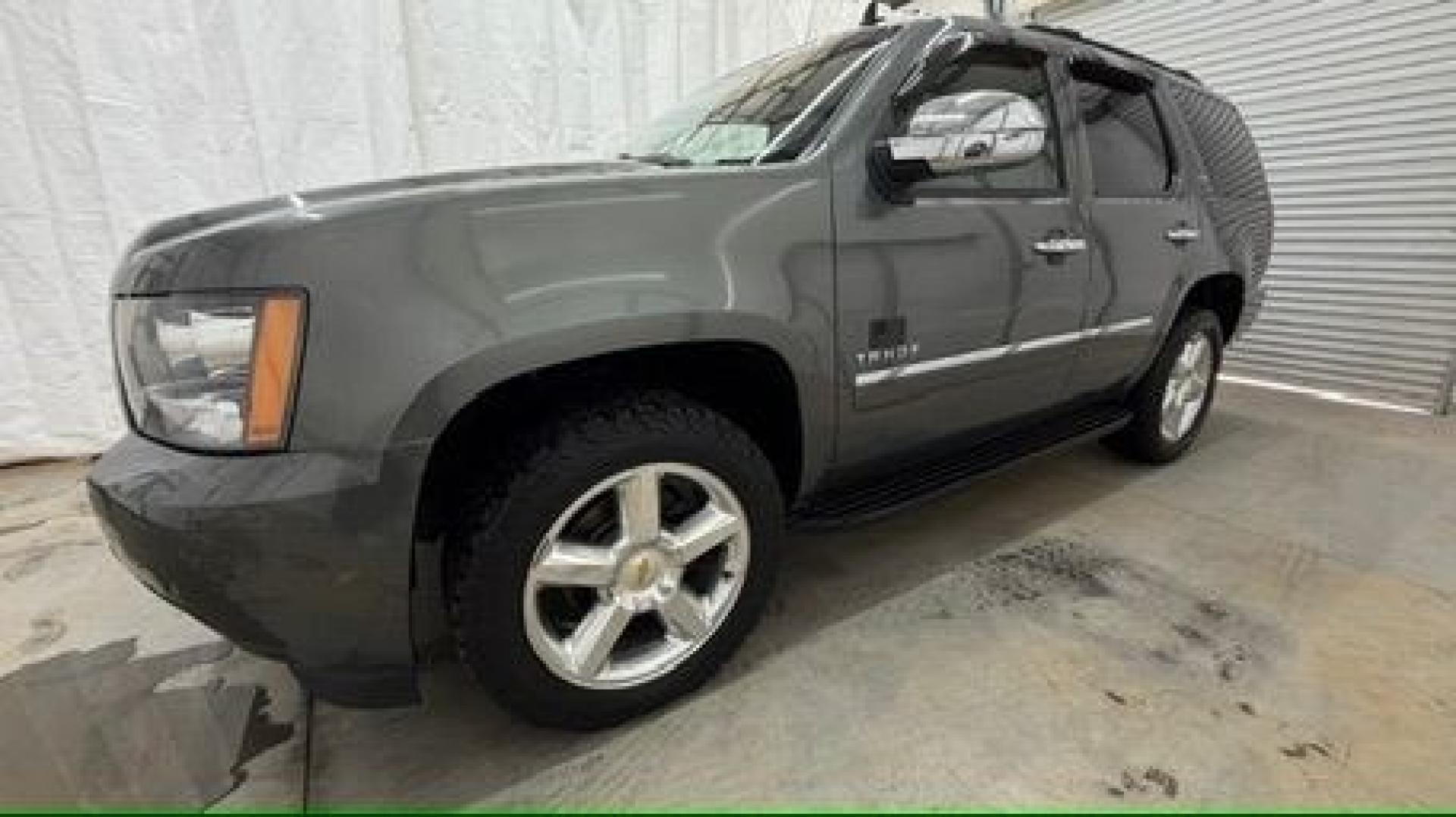 2011 Green Chevrolet Tahoe LTZ 2WD (1GNSCCE05BR) with an 5.3L V8 OHV 16V FFV engine, 6-Speed Automatic transmission, located at 1806 Veterans Memorial Hwy SW, Austell, GA, 30168, (770) 944-9558, 33.817959, -84.606987 - Photo#1