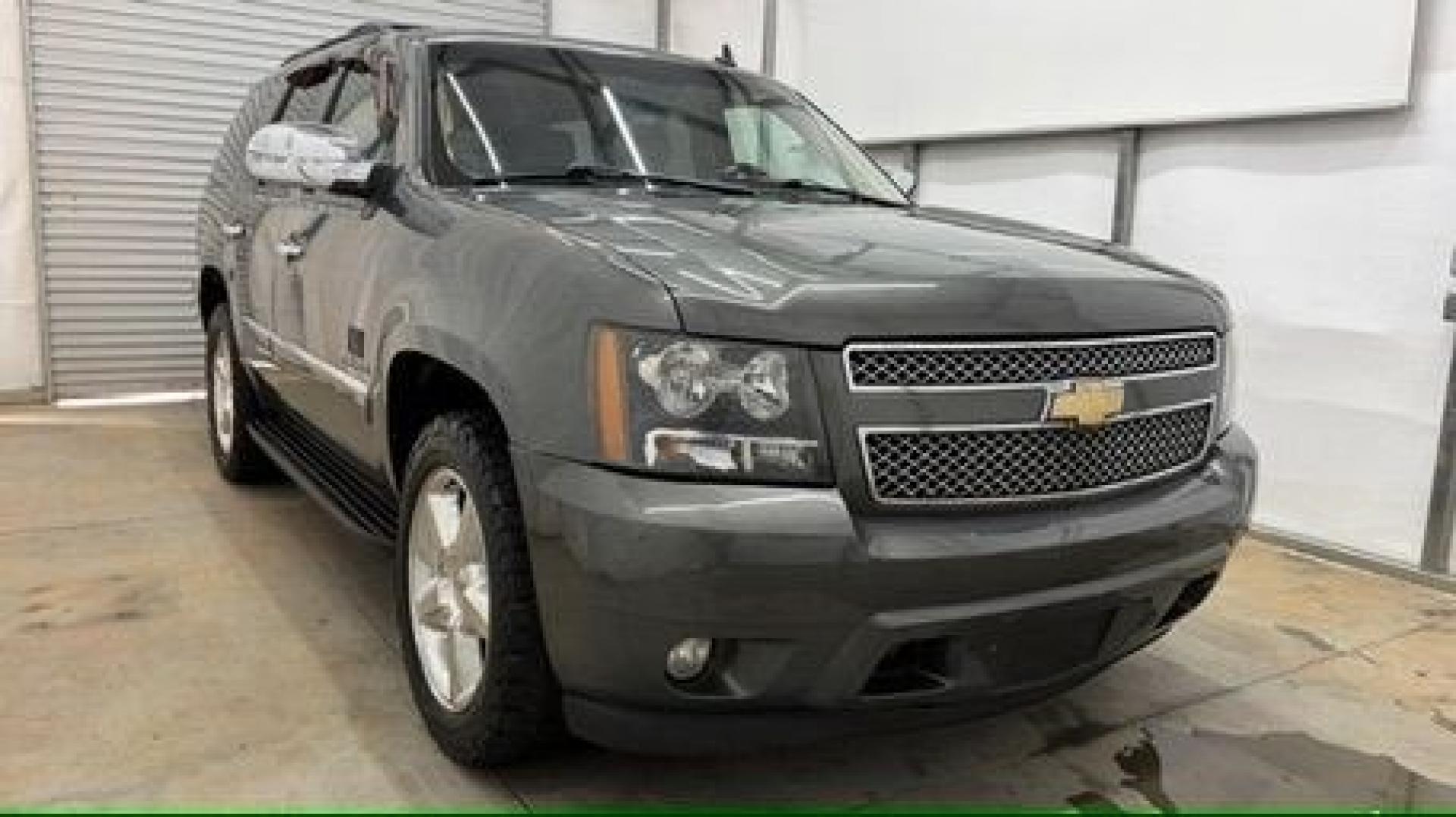 2011 Green Chevrolet Tahoe LTZ 2WD (1GNSCCE05BR) with an 5.3L V8 OHV 16V FFV engine, 6-Speed Automatic transmission, located at 1806 Veterans Memorial Hwy SW, Austell, GA, 30168, (770) 944-9558, 33.817959, -84.606987 - Photo#2