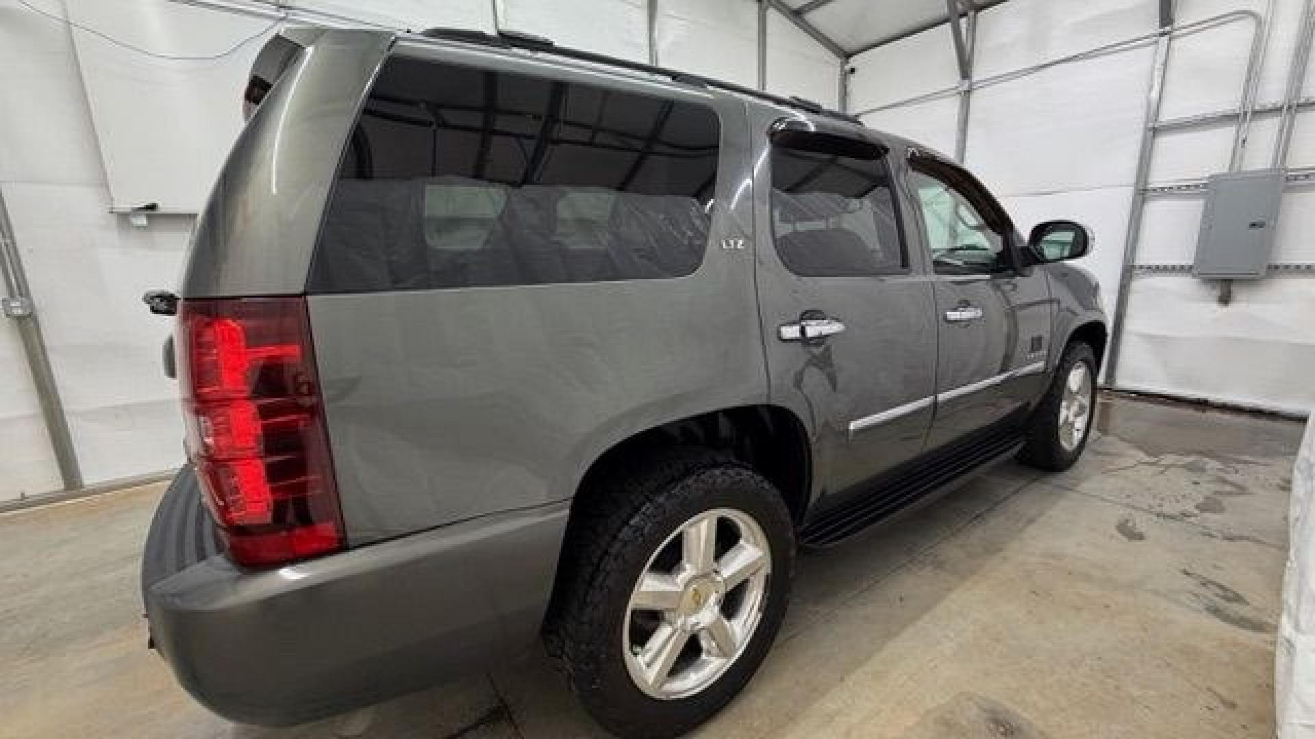 2011 Green Chevrolet Tahoe LTZ 2WD (1GNSCCE05BR) with an 5.3L V8 OHV 16V FFV engine, 6-Speed Automatic transmission, located at 1806 Veterans Memorial Hwy SW, Austell, GA, 30168, (770) 944-9558, 33.817959, -84.606987 - Photo#8