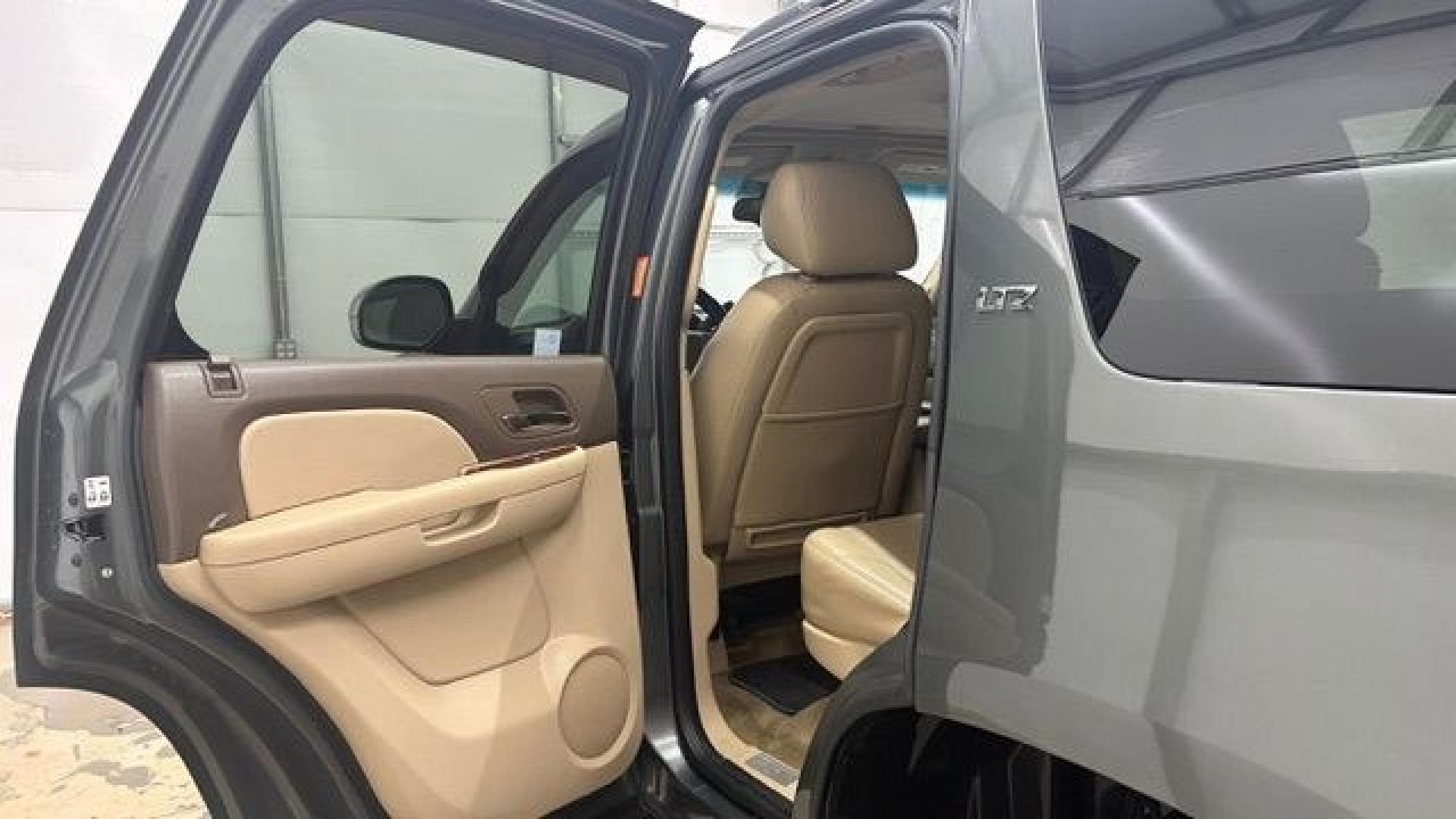 2011 Green Chevrolet Tahoe LTZ 2WD (1GNSCCE05BR) with an 5.3L V8 OHV 16V FFV engine, 6-Speed Automatic transmission, located at 1806 Veterans Memorial Hwy SW, Austell, GA, 30168, (770) 944-9558, 33.817959, -84.606987 - Photo#13