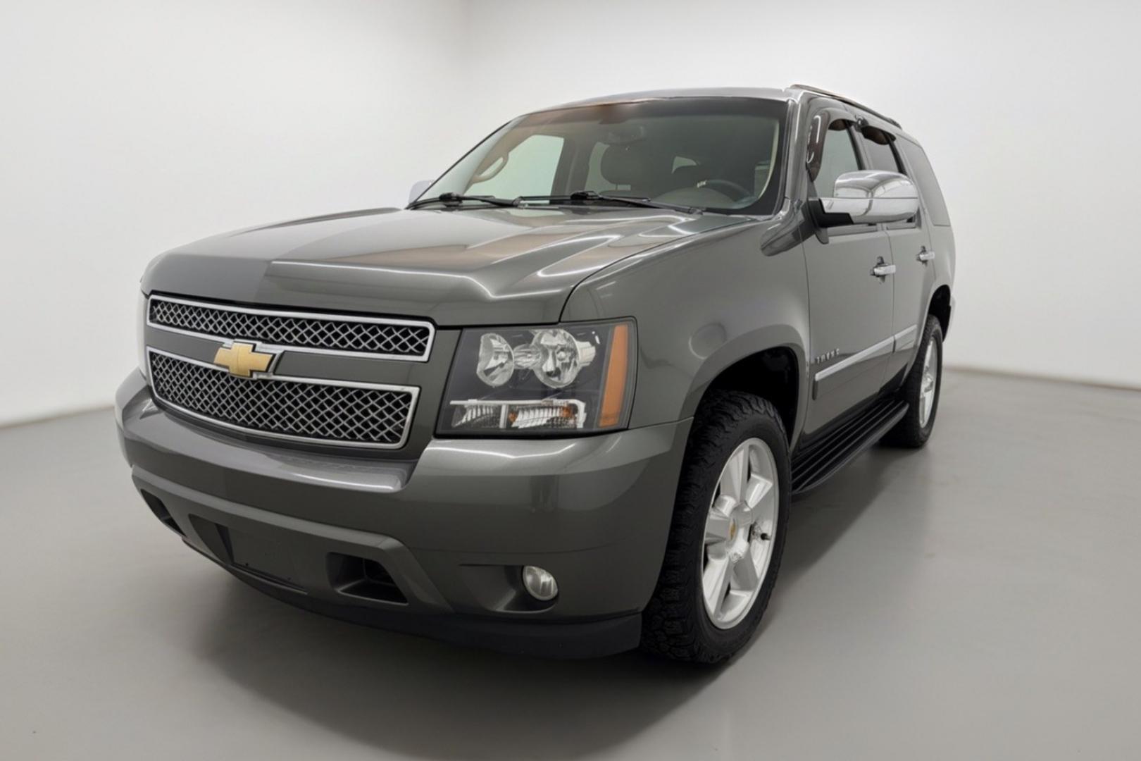 2011 Green Chevrolet Tahoe LTZ 2WD (1GNSCCE05BR) with an 5.3L V8 OHV 16V FFV engine, 6-Speed Automatic transmission, located at 1806 Veterans Memorial Hwy SW, Austell, GA, 30168, (770) 944-9558, 33.817959, -84.606987 - Photo#0
