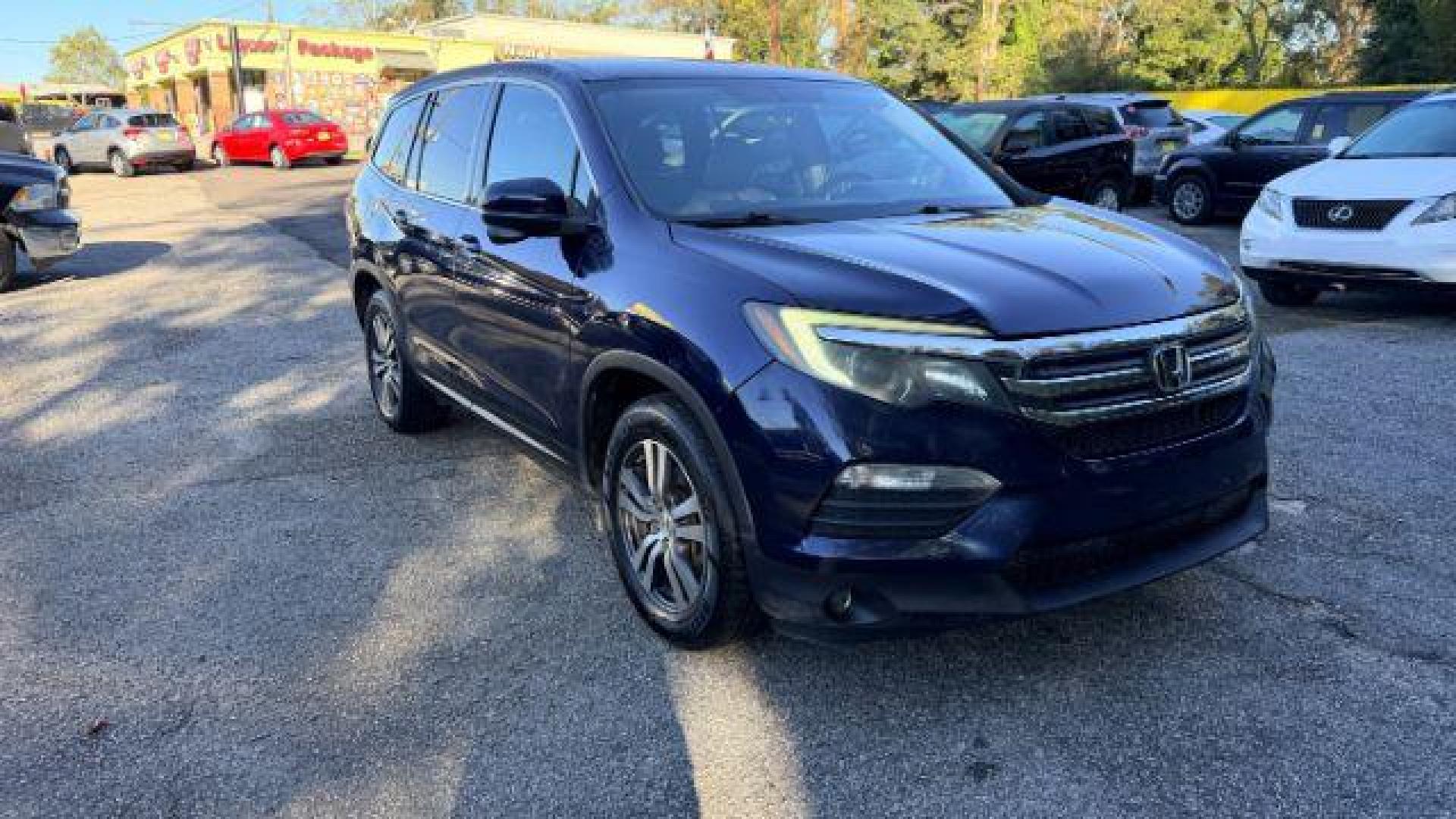 2016 Blue Honda Pilot EX 2WD (5FNYF5H35GB) with an 3.5L V6 SOHC 24V engine, 6-Speed Automatic transmission, located at 1806 Veterans Memorial Hwy SW, Austell, GA, 30168, (770) 944-9558, 33.817959, -84.606987 - Photo#2