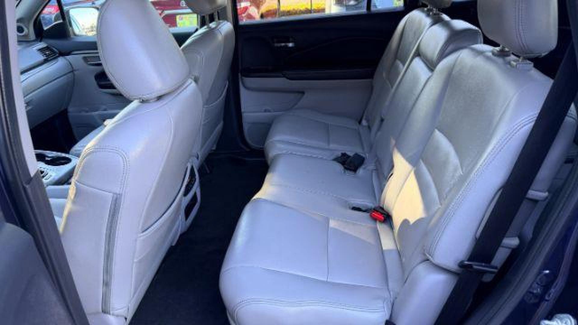 2016 Blue Honda Pilot EX 2WD (5FNYF5H35GB) with an 3.5L V6 SOHC 24V engine, 6-Speed Automatic transmission, located at 1806 Veterans Memorial Hwy SW, Austell, GA, 30168, (770) 944-9558, 33.817959, -84.606987 - Photo#7