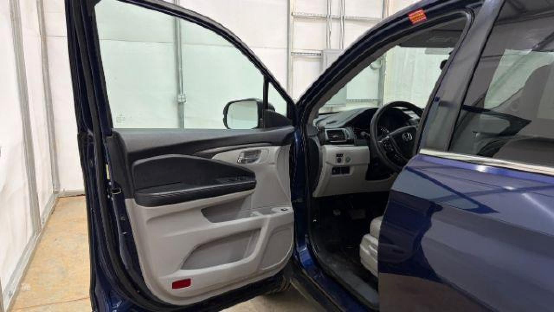 2016 Blue Honda Pilot EX 2WD (5FNYF5H35GB) with an 3.5L V6 SOHC 24V engine, 6-Speed Automatic transmission, located at 1806 Veterans Memorial Hwy SW, Austell, GA, 30168, (770) 944-9558, 33.817959, -84.606987 - Photo#9