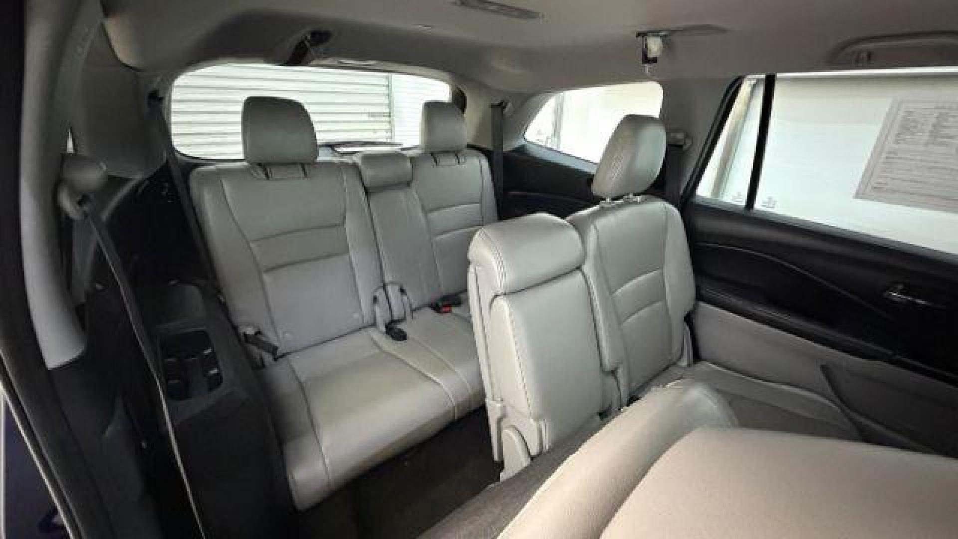 2016 Blue Honda Pilot EX 2WD (5FNYF5H35GB) with an 3.5L V6 SOHC 24V engine, 6-Speed Automatic transmission, located at 1806 Veterans Memorial Hwy SW, Austell, GA, 30168, (770) 944-9558, 33.817959, -84.606987 - Photo#16