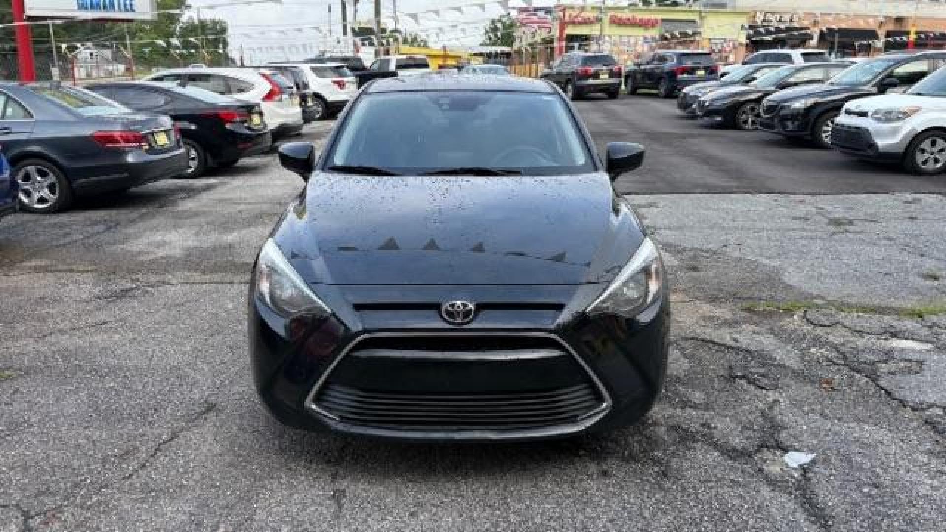 2018 Black Toyota Yaris iA 6A (3MYDLBYVXJY) with an 1.5L L4 DOHC 16V engine, 6-Speed Automatic transmission, located at 1806 Veterans Memorial Hwy SW, Austell, GA, 30168, (770) 944-9558, 33.817959, -84.606987 - Photo#1