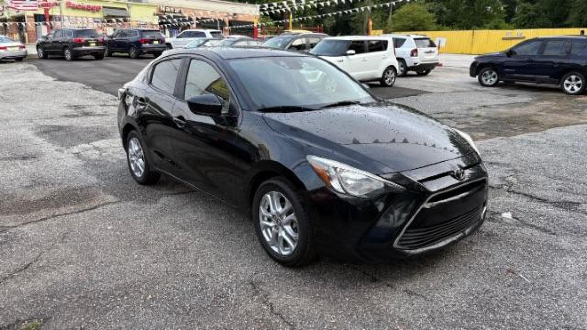 2018 Black Toyota Yaris iA 6A (3MYDLBYVXJY) with an 1.5L L4 DOHC 16V engine, 6-Speed Automatic transmission, located at 1806 Veterans Memorial Hwy SW, Austell, GA, 30168, (770) 944-9558, 33.817959, -84.606987 - Photo#2
