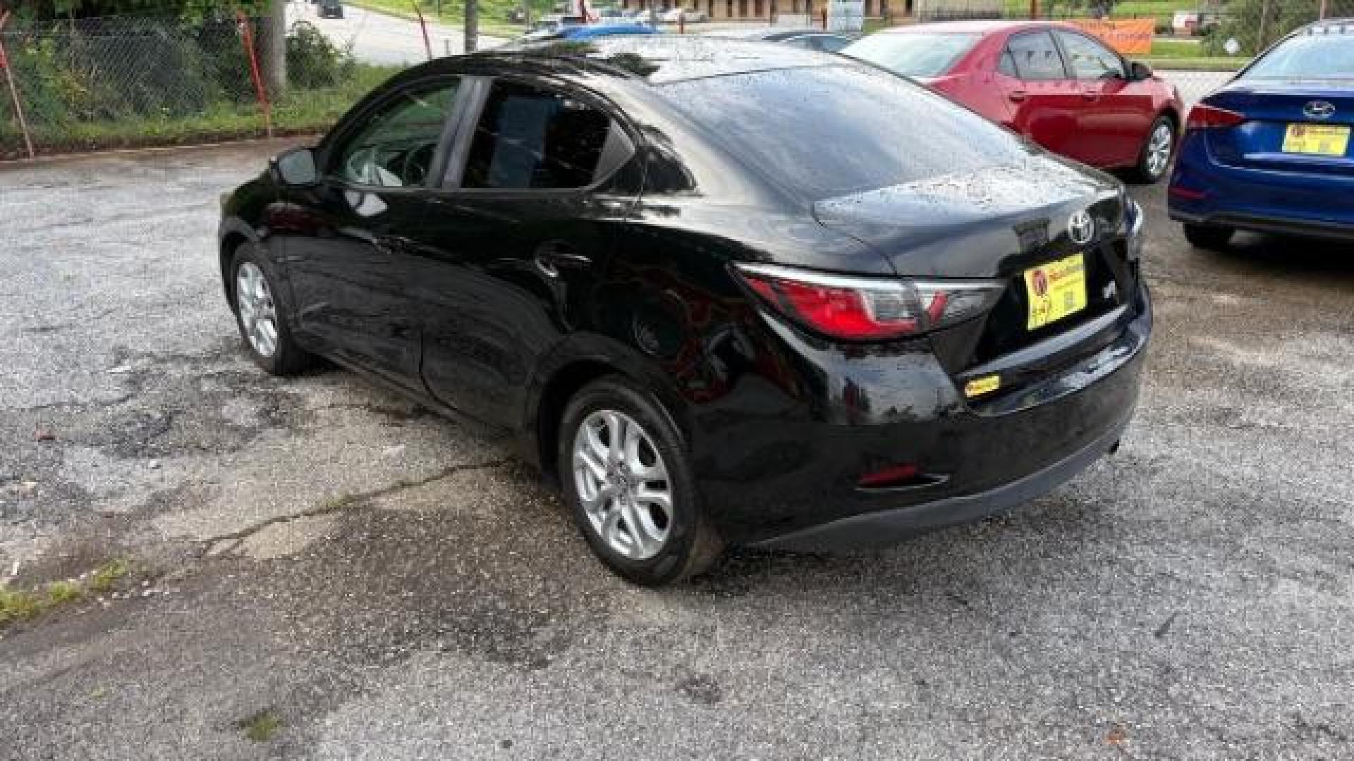 2018 Black Toyota Yaris iA 6A (3MYDLBYVXJY) with an 1.5L L4 DOHC 16V engine, 6-Speed Automatic transmission, located at 1806 Veterans Memorial Hwy SW, Austell, GA, 30168, (770) 944-9558, 33.817959, -84.606987 - Photo#3