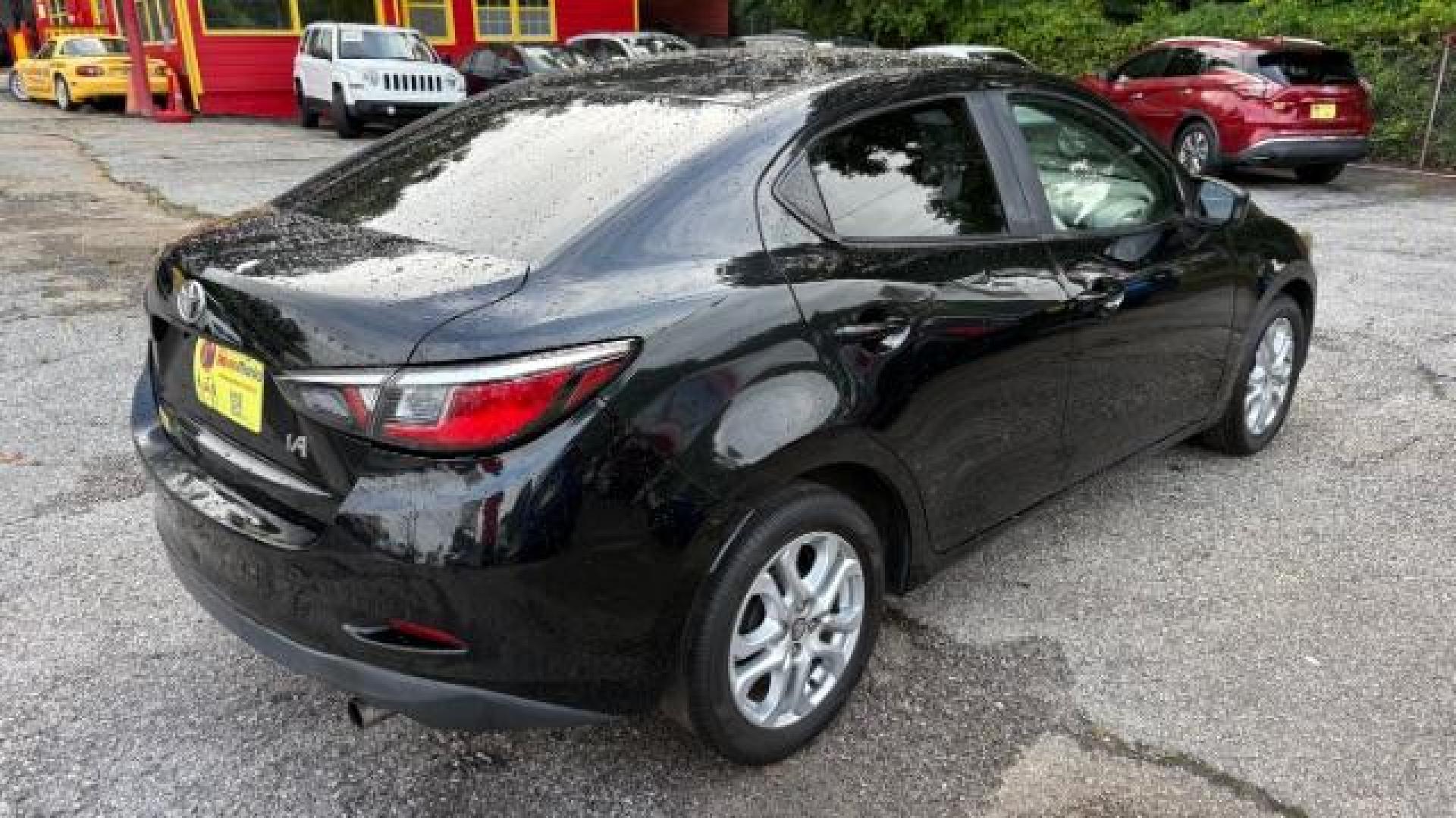 2018 Black Toyota Yaris iA 6A (3MYDLBYVXJY) with an 1.5L L4 DOHC 16V engine, 6-Speed Automatic transmission, located at 1806 Veterans Memorial Hwy SW, Austell, GA, 30168, (770) 944-9558, 33.817959, -84.606987 - Photo#4