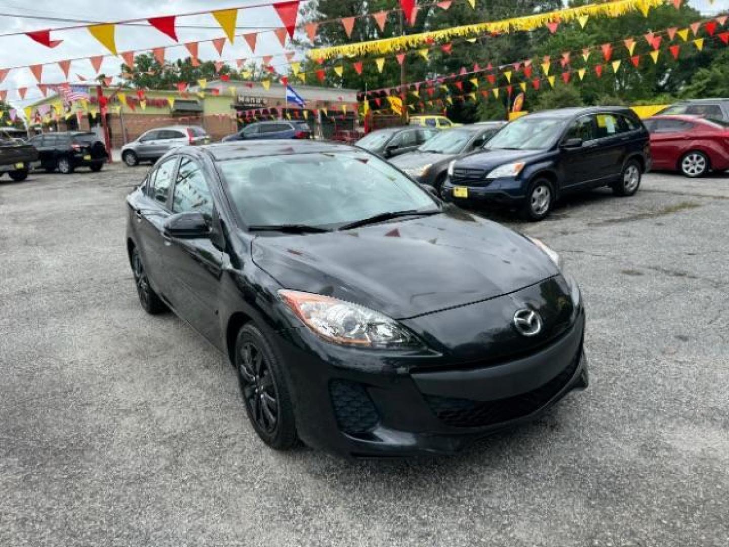 2013 Black Mazda MAZDA3 i SV AT 4-Door (JM1BL1TF0D1) with an 2.0L L4 DOHC 16V engine, 5-Speed Automatic transmission, located at 1806 Veterans Memorial Hwy SW, Austell, GA, 30168, (770) 944-9558, 33.817959, -84.606987 - Photo#3