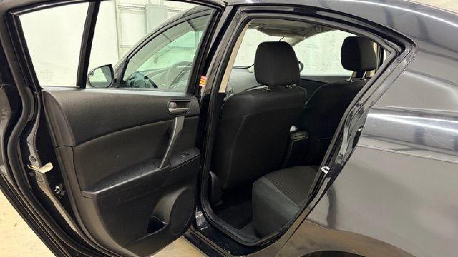 2013 Black Mazda MAZDA3 i SV AT 4-Door (JM1BL1TF0D1) with an 2.0L L4 DOHC 16V engine, 5-Speed Automatic transmission, located at 1806 Veterans Memorial Hwy SW, Austell, GA, 30168, (770) 944-9558, 33.817959, -84.606987 - Photo#13