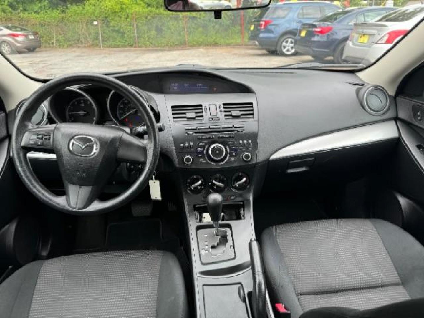2013 Black Mazda MAZDA3 i SV AT 4-Door (JM1BL1TF0D1) with an 2.0L L4 DOHC 16V engine, 5-Speed Automatic transmission, located at 1806 Veterans Memorial Hwy SW, Austell, GA, 30168, (770) 944-9558, 33.817959, -84.606987 - Photo#11