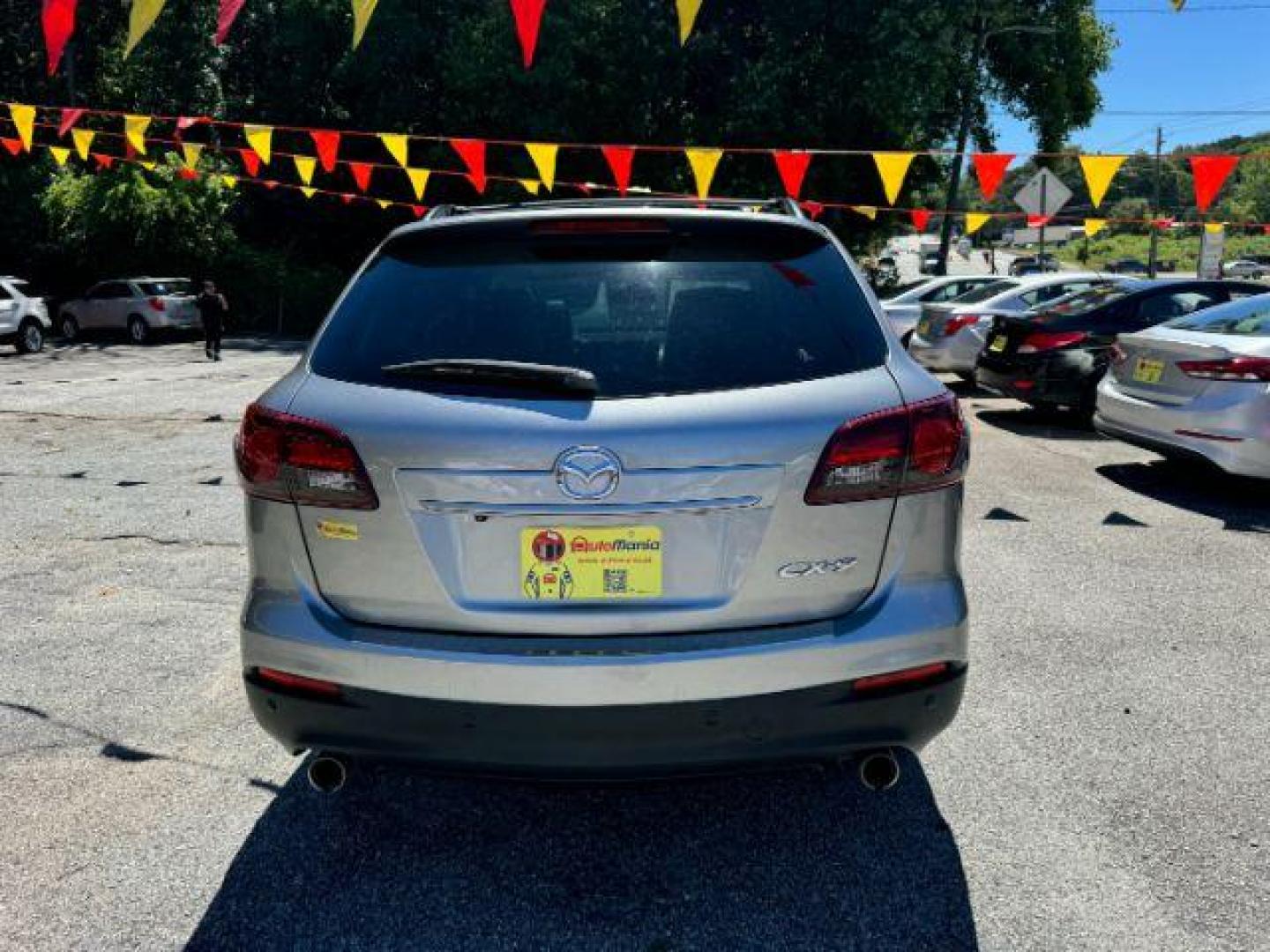 2015 Silver Mazda CX-9 Grand Touring (JM3TB2DAXF0) with an 3.7L V6 DOHC 24V engine, 6-Speed Automatic transmission, located at 1806 Veterans Memorial Hwy SW, Austell, GA, 30168, (770) 944-9558, 33.817959, -84.606987 - Photo#4