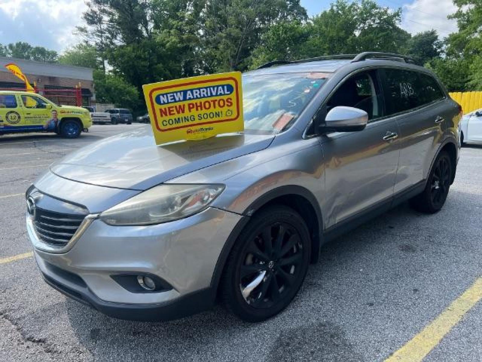 2015 Silver Mazda CX-9 Grand Touring (JM3TB2DAXF0) with an 3.7L V6 DOHC 24V engine, 6-Speed Automatic transmission, located at 1806 Veterans Memorial Hwy SW, Austell, GA, 30168, (770) 944-9558, 33.817959, -84.606987 - Photo #0