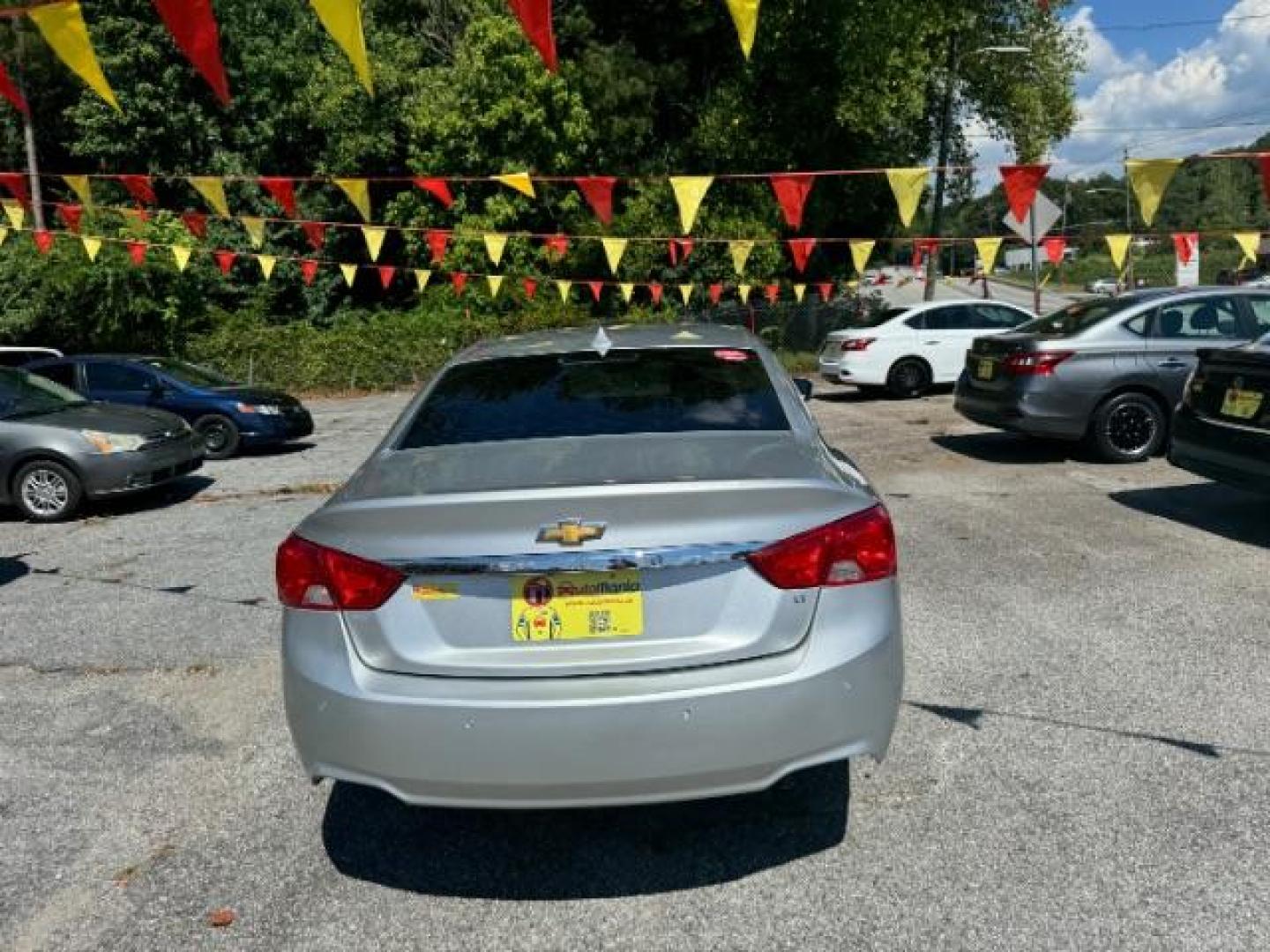 2014 Silver Chevrolet Impala 1LT (2G1115SL5E9) with an 2.5L L4 DOHC 16V engine, 6-Speed Automatic transmission, located at 1806 Veterans Memorial Hwy SW, Austell, GA, 30168, (770) 944-9558, 33.817959, -84.606987 - Photo#3