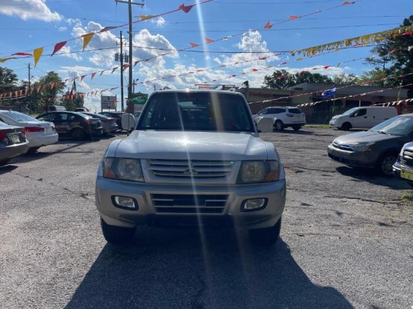 2002 White Mitsubishi Montero SPORT UTILITY 4-DR (JA4MW51R42J) with an 3.5L V6 SOHC 24V engine, 5-Speed Automatic transmission, located at 1806 Veterans Memorial Hwy SW, Austell, GA, 30168, (770) 944-9558, 33.817959, -84.606987 - Photo#0