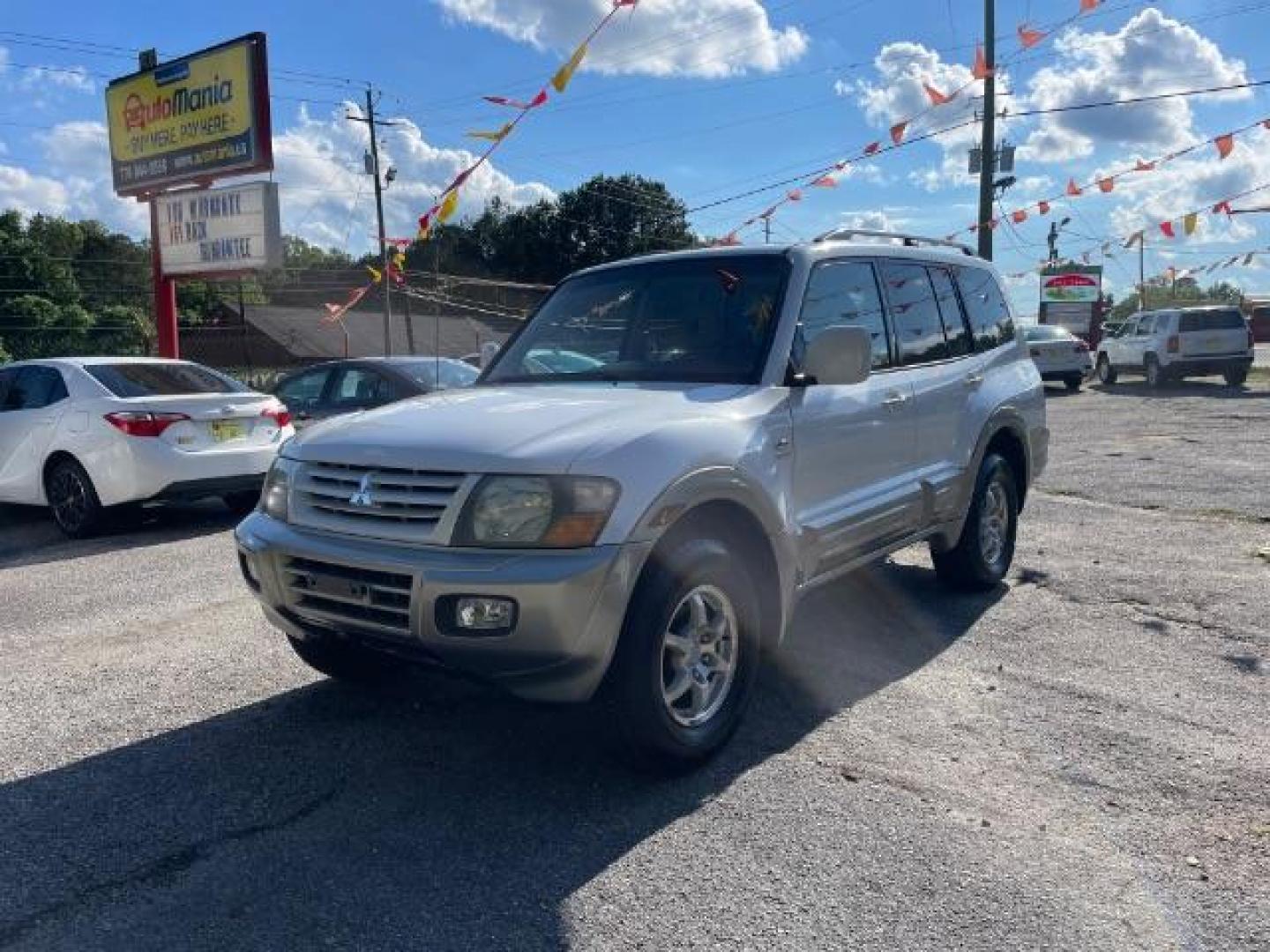 2002 White Mitsubishi Montero SPORT UTILITY 4-DR (JA4MW51R42J) with an 3.5L V6 SOHC 24V engine, 5-Speed Automatic transmission, located at 1806 Veterans Memorial Hwy SW, Austell, GA, 30168, (770) 944-9558, 33.817959, -84.606987 - Photo#2