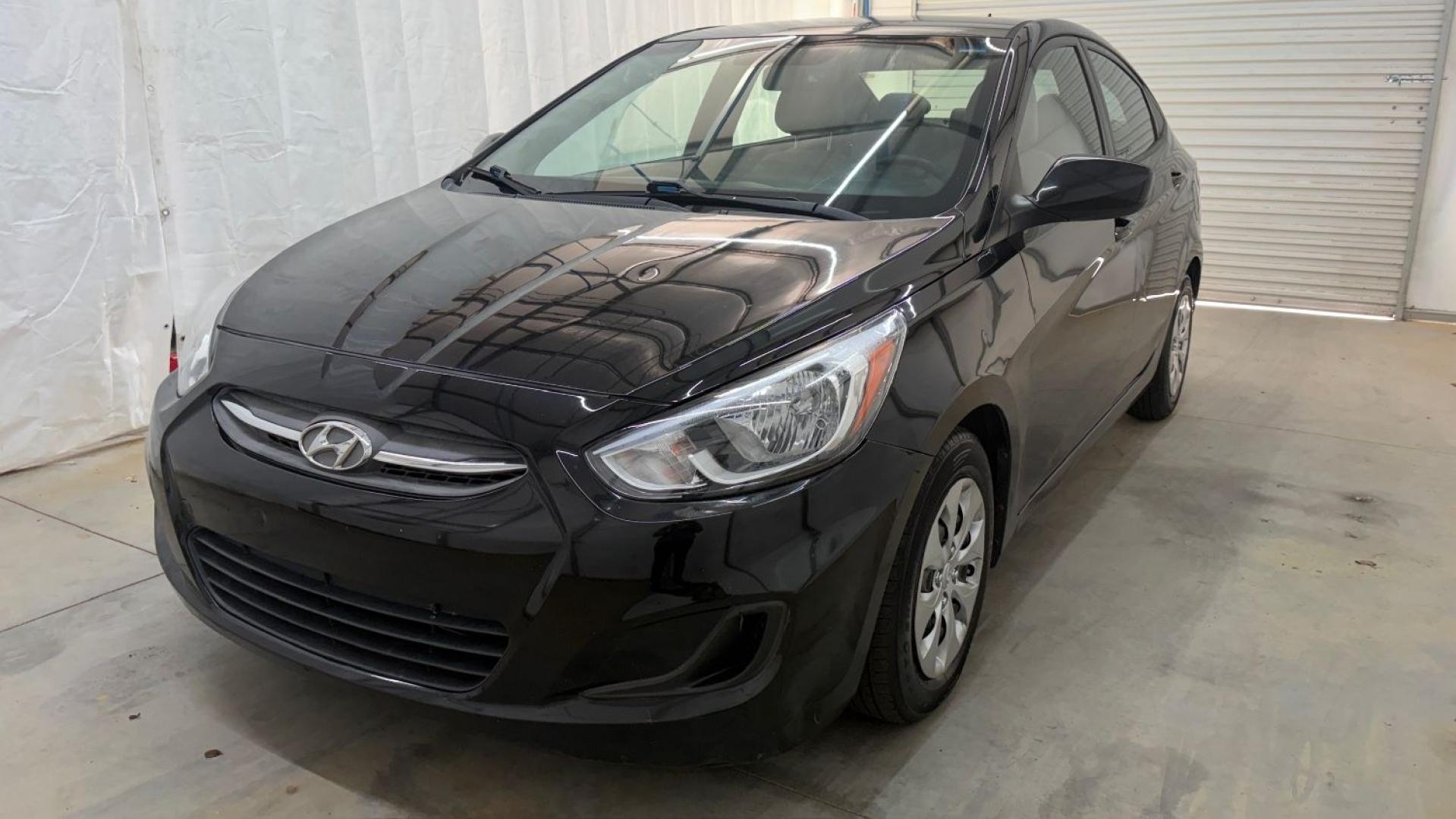 2017 Black Hyundai Accent SE 4-Door 6A (KMHCT4AE7HU) with an 1.6L L4 DOHC 16V engine, 6-Speed Automatic transmission, located at 1806 Veterans Memorial Hwy SW, Austell, GA, 30168, (770) 944-9558, 33.817959, -84.606987- Photo#0