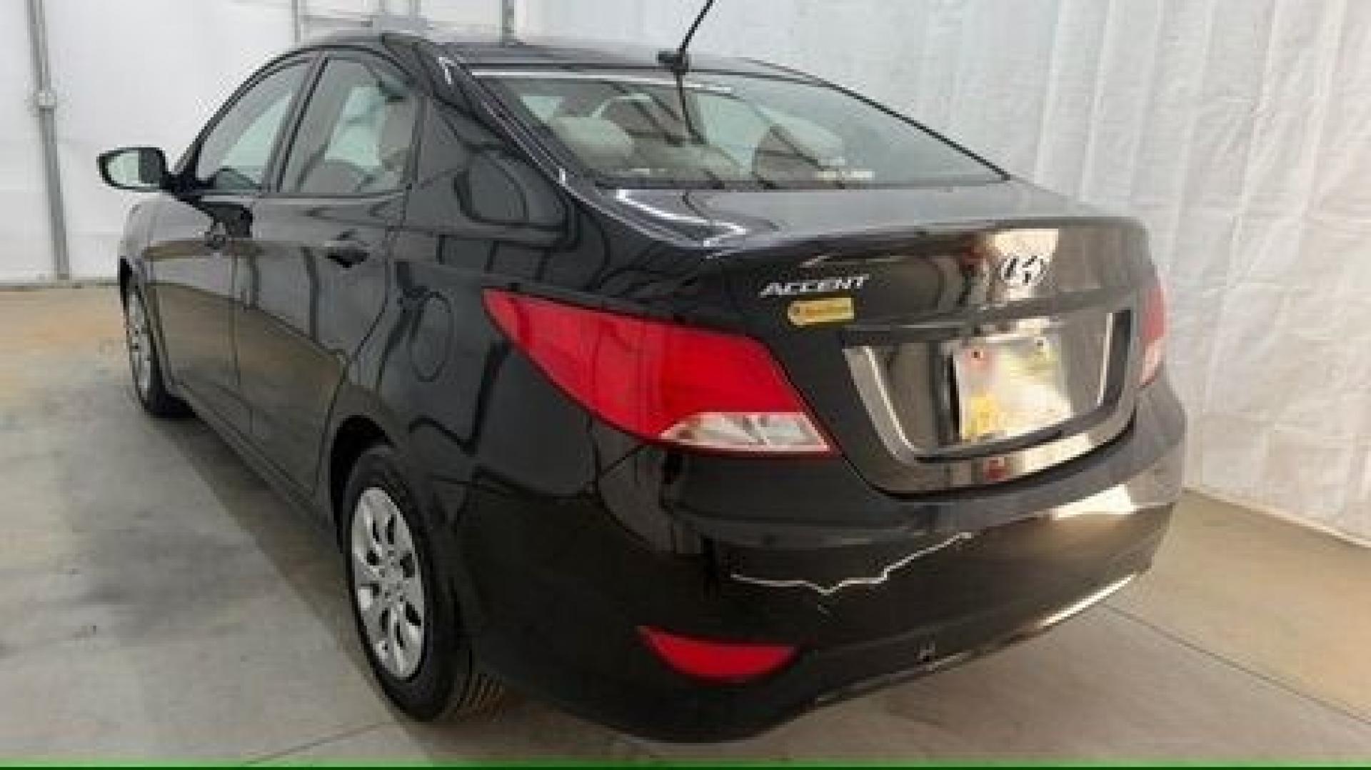 2017 Black Hyundai Accent SE 4-Door 6A (KMHCT4AE7HU) with an 1.6L L4 DOHC 16V engine, 6-Speed Automatic transmission, located at 1806 Veterans Memorial Hwy SW, Austell, GA, 30168, (770) 944-9558, 33.817959, -84.606987- Photo#3