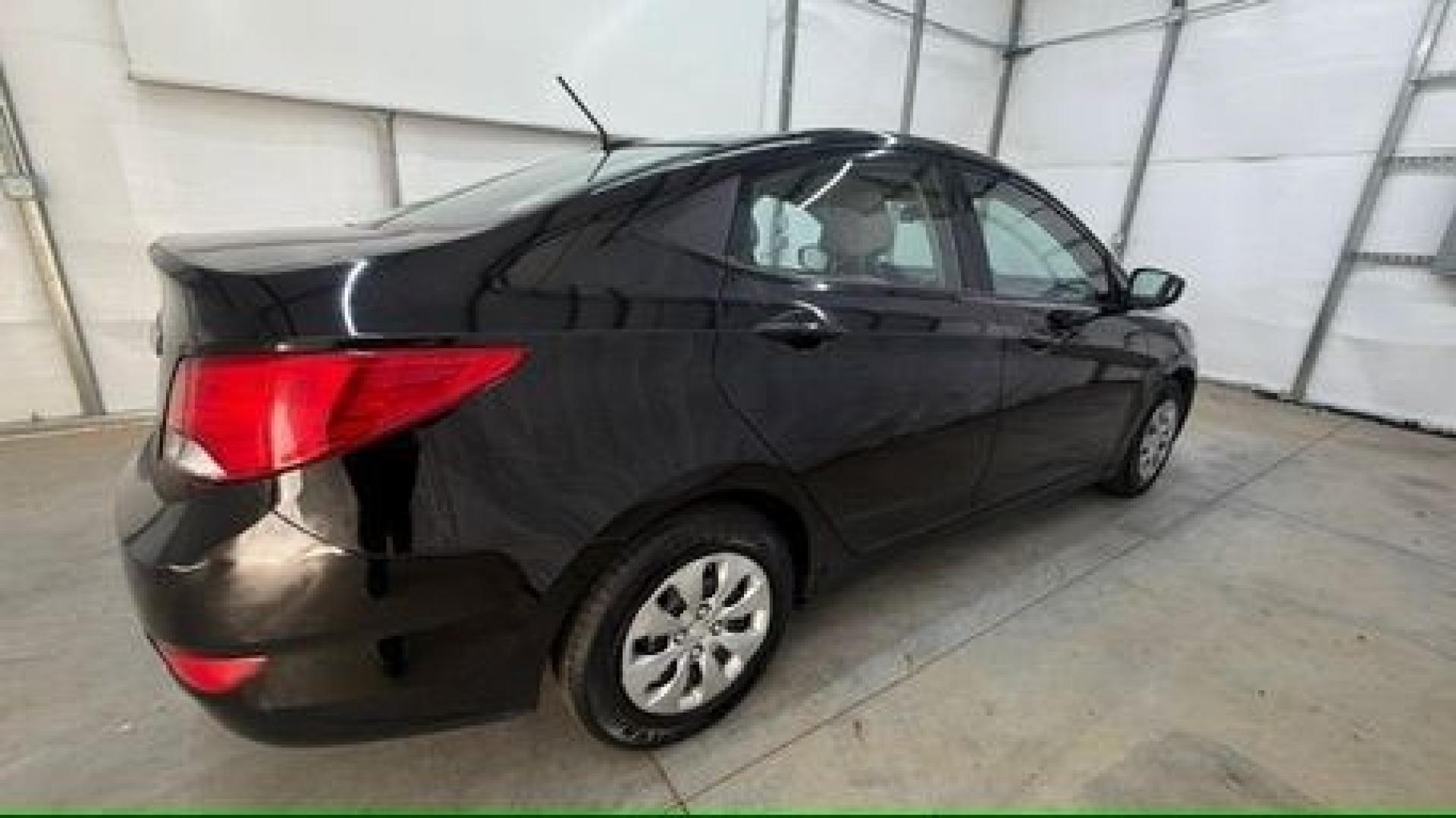 2017 Black Hyundai Accent SE 4-Door 6A (KMHCT4AE7HU) with an 1.6L L4 DOHC 16V engine, 6-Speed Automatic transmission, located at 1806 Veterans Memorial Hwy SW, Austell, GA, 30168, (770) 944-9558, 33.817959, -84.606987- Photo#6