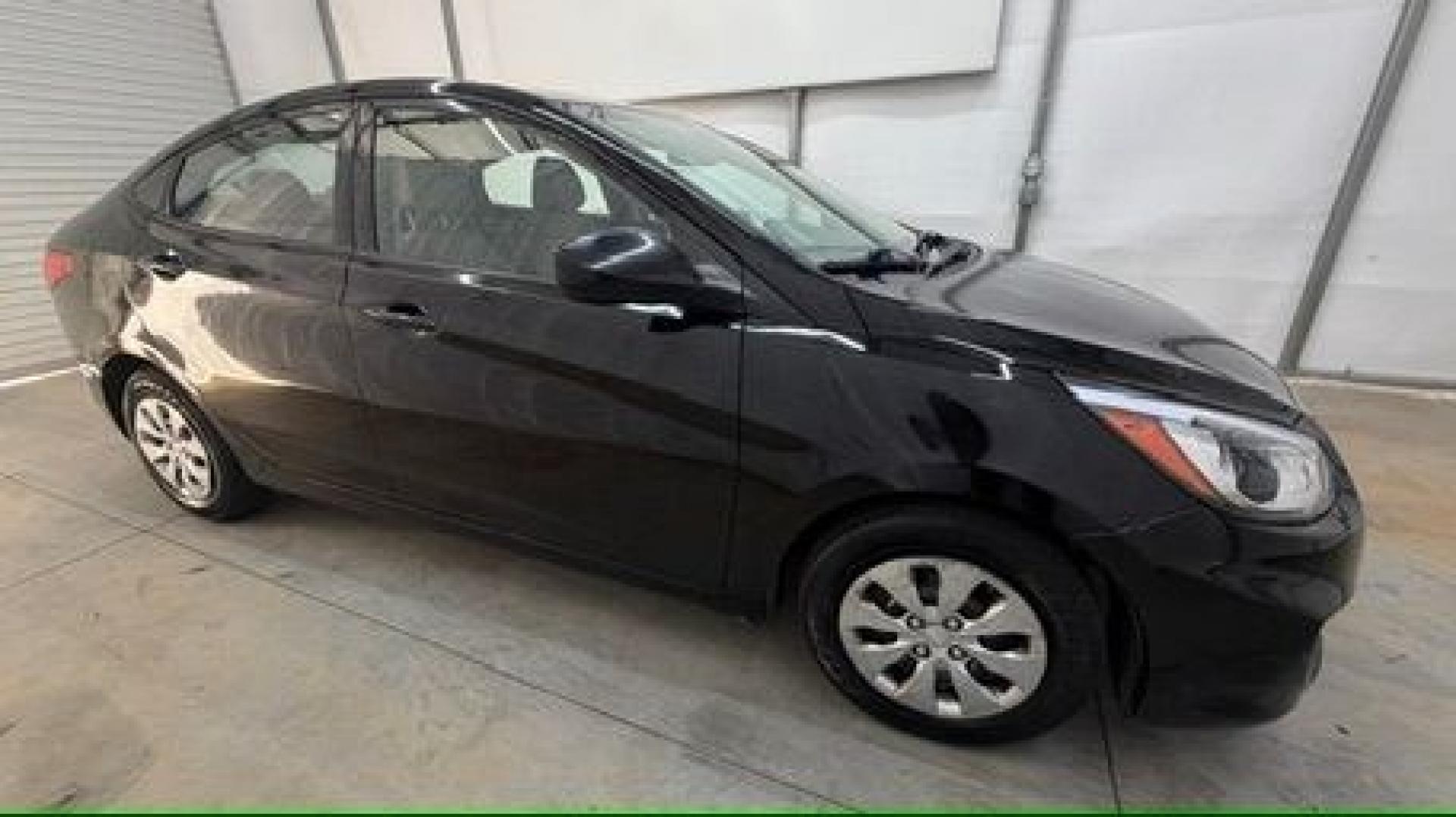 2017 Black Hyundai Accent SE 4-Door 6A (KMHCT4AE7HU) with an 1.6L L4 DOHC 16V engine, 6-Speed Automatic transmission, located at 1806 Veterans Memorial Hwy SW, Austell, GA, 30168, (770) 944-9558, 33.817959, -84.606987- Photo#7