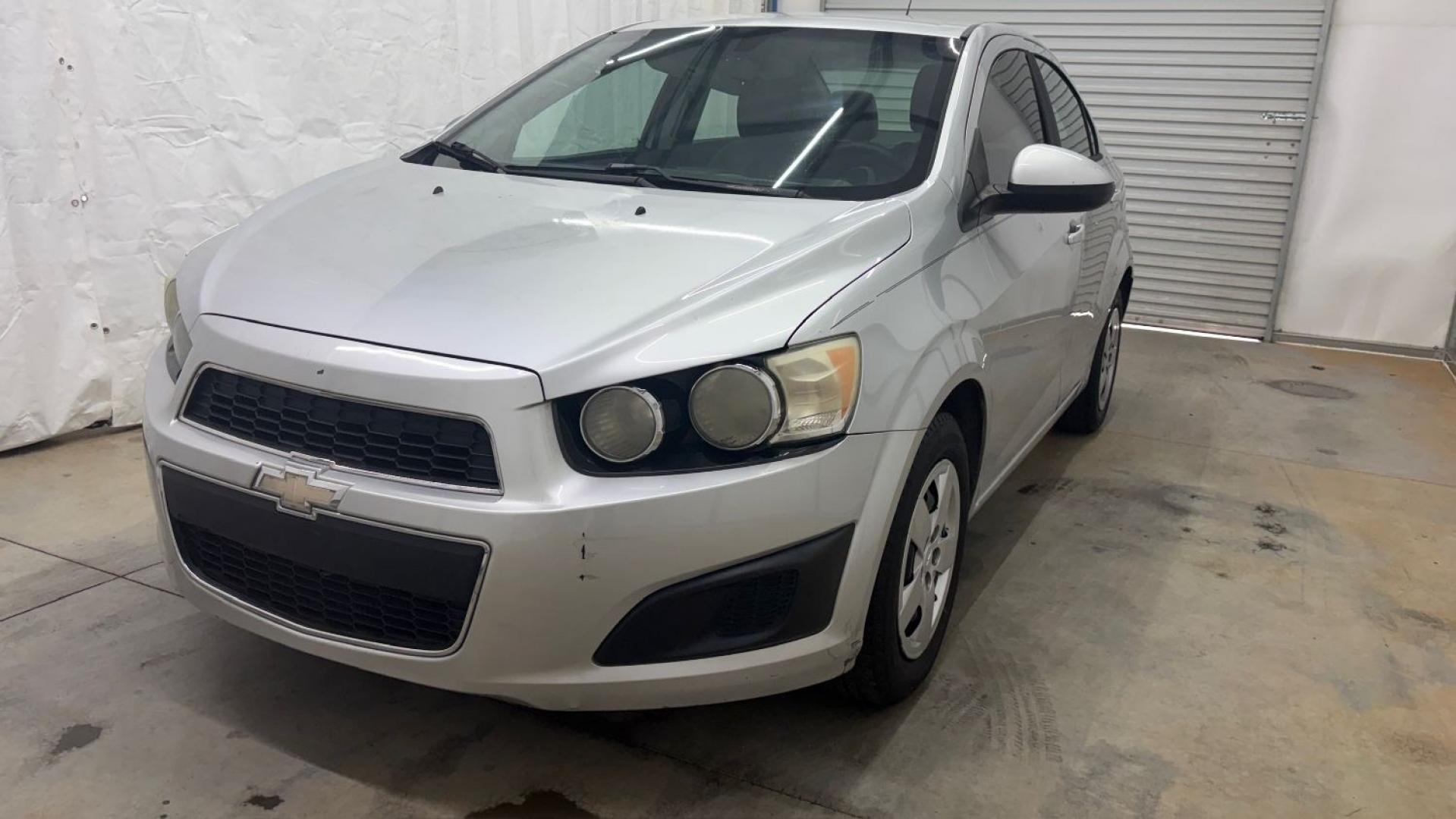 2015 Silver Chevrolet Sonic LS Auto Sedan (1G1JA5SH0F4) with an 1.8L L4 DOHC 24V engine, 6-Speed Automatic transmission, located at 1806 Veterans Memorial Hwy SW, Austell, GA, 30168, (770) 944-9558, 33.817959, -84.606987 - Photo#0