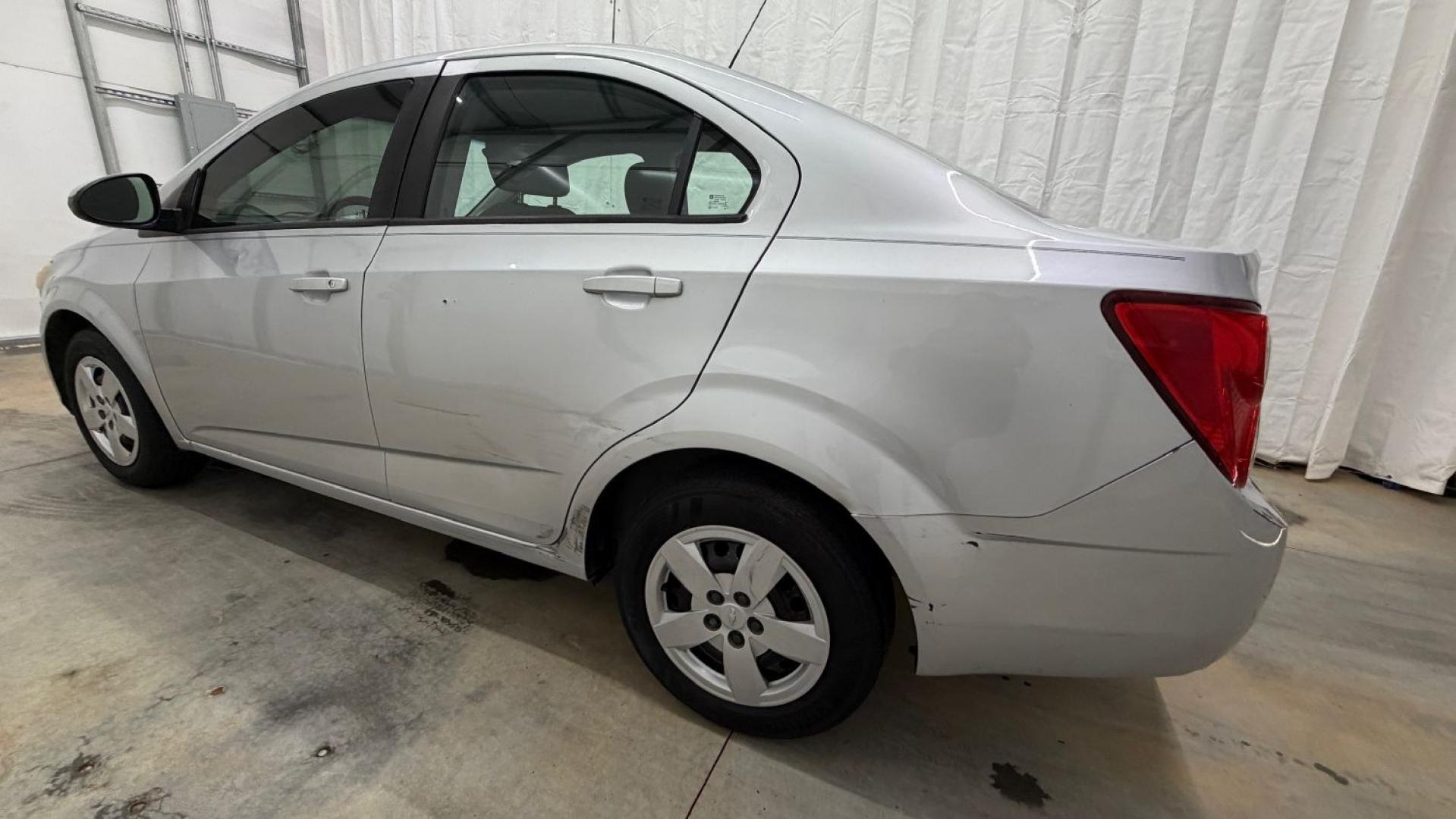 2015 Silver Chevrolet Sonic LS Auto Sedan (1G1JA5SH0F4) with an 1.8L L4 DOHC 24V engine, 6-Speed Automatic transmission, located at 1806 Veterans Memorial Hwy SW, Austell, GA, 30168, (770) 944-9558, 33.817959, -84.606987 - Photo#2